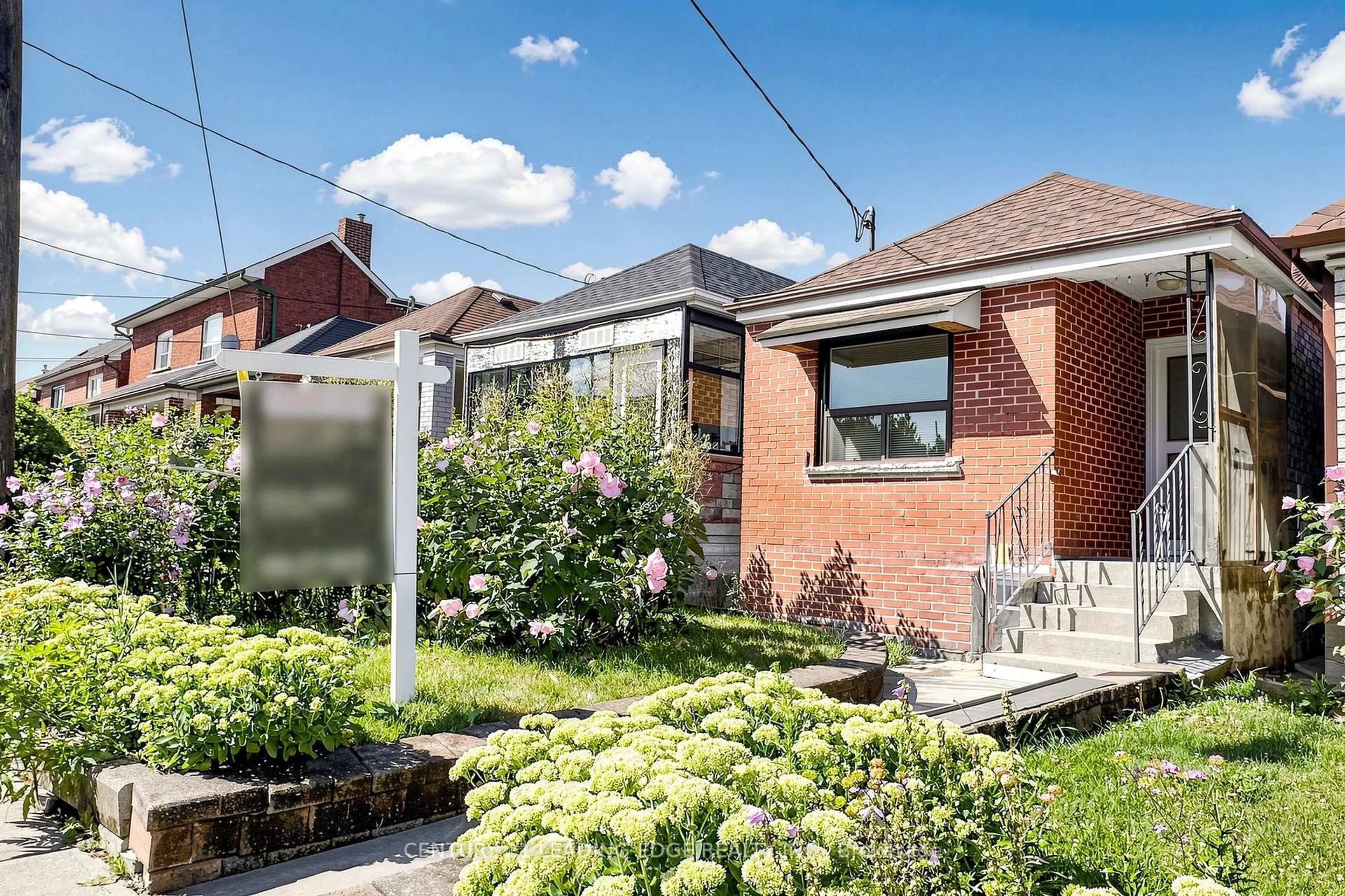 Home with brick exterior material, street for 180 Gilbert Ave, Toronto Ontario M6E 4W5