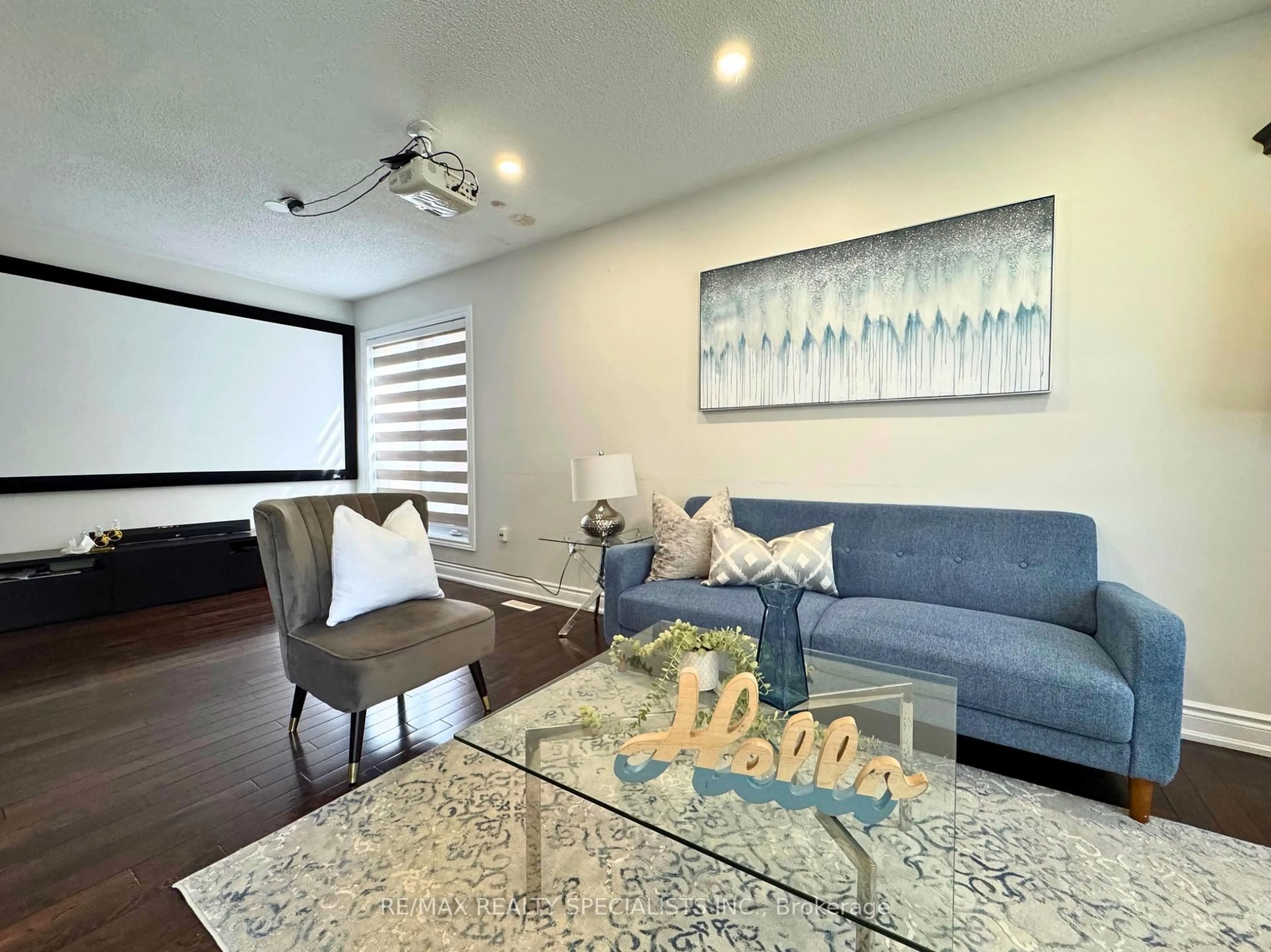 Living room with furniture, wood/laminate floor for 22 Clayborne Ave, Brampton Ontario L7A 1N8