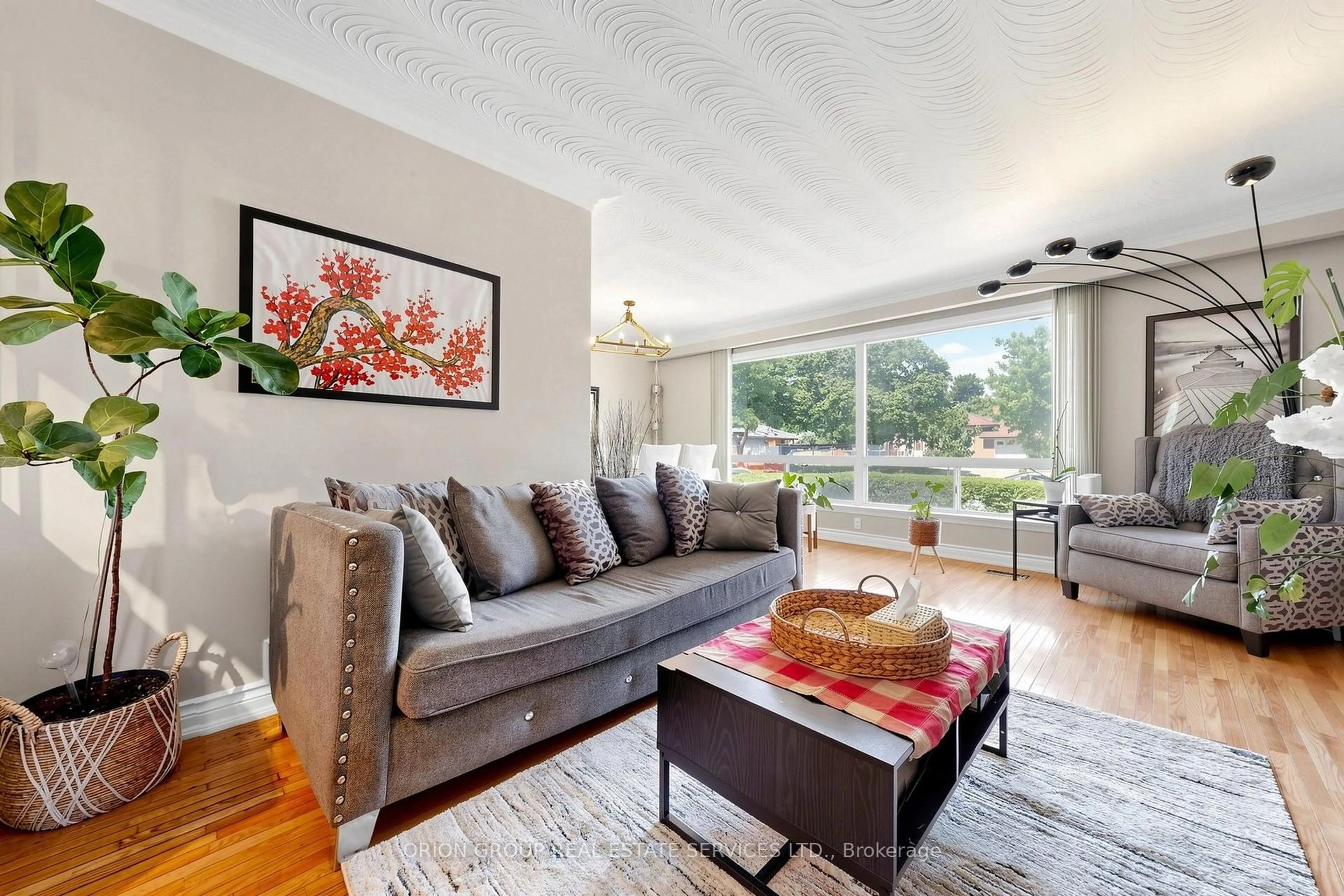Living room with furniture, wood/laminate floor for 145 Kingsview Blvd, Toronto Ontario M9R 1V7