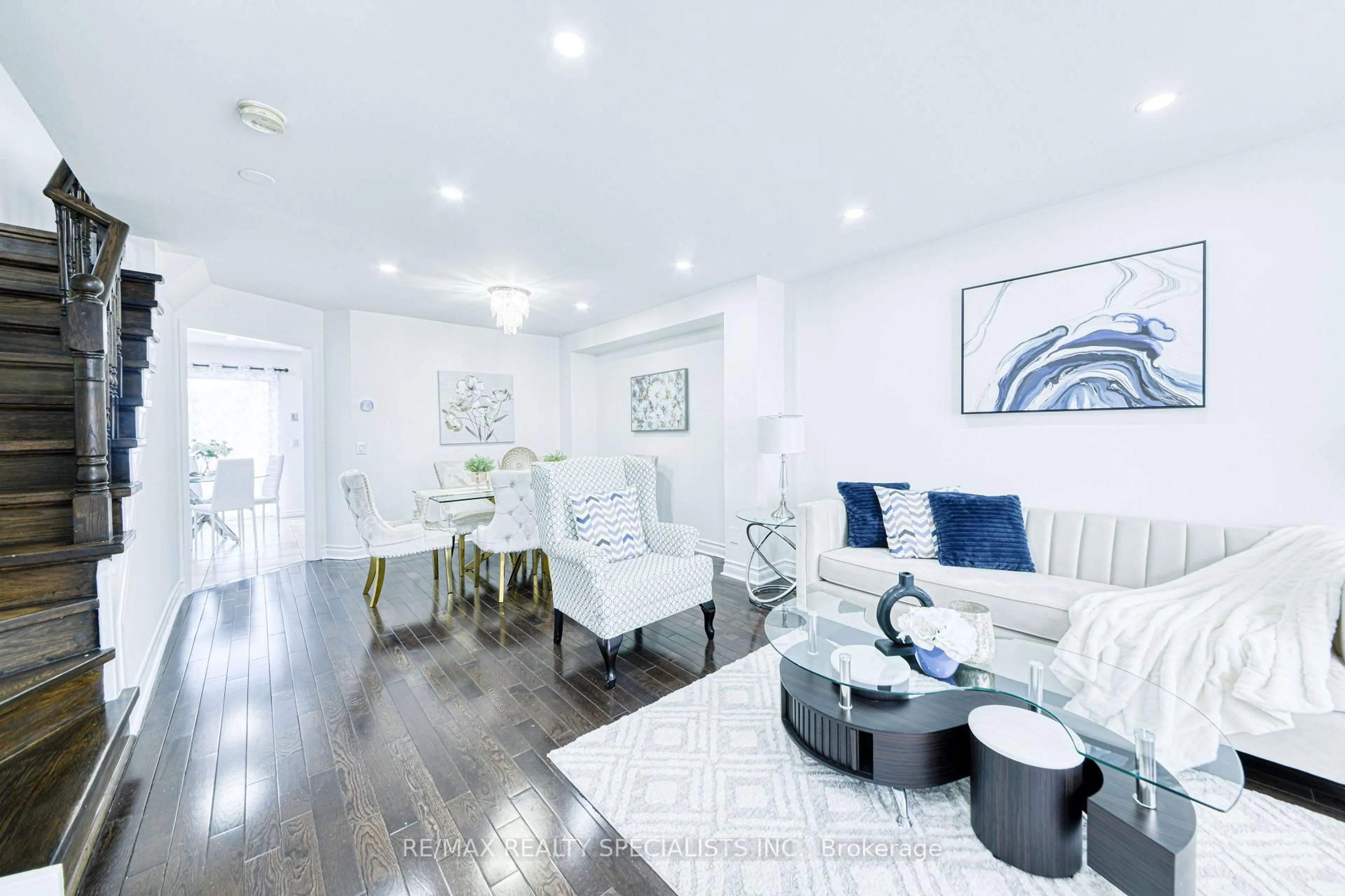 Living room with furniture, wood/laminate floor for 35 Softneedle Ave, Brampton Ontario L6R 1K4