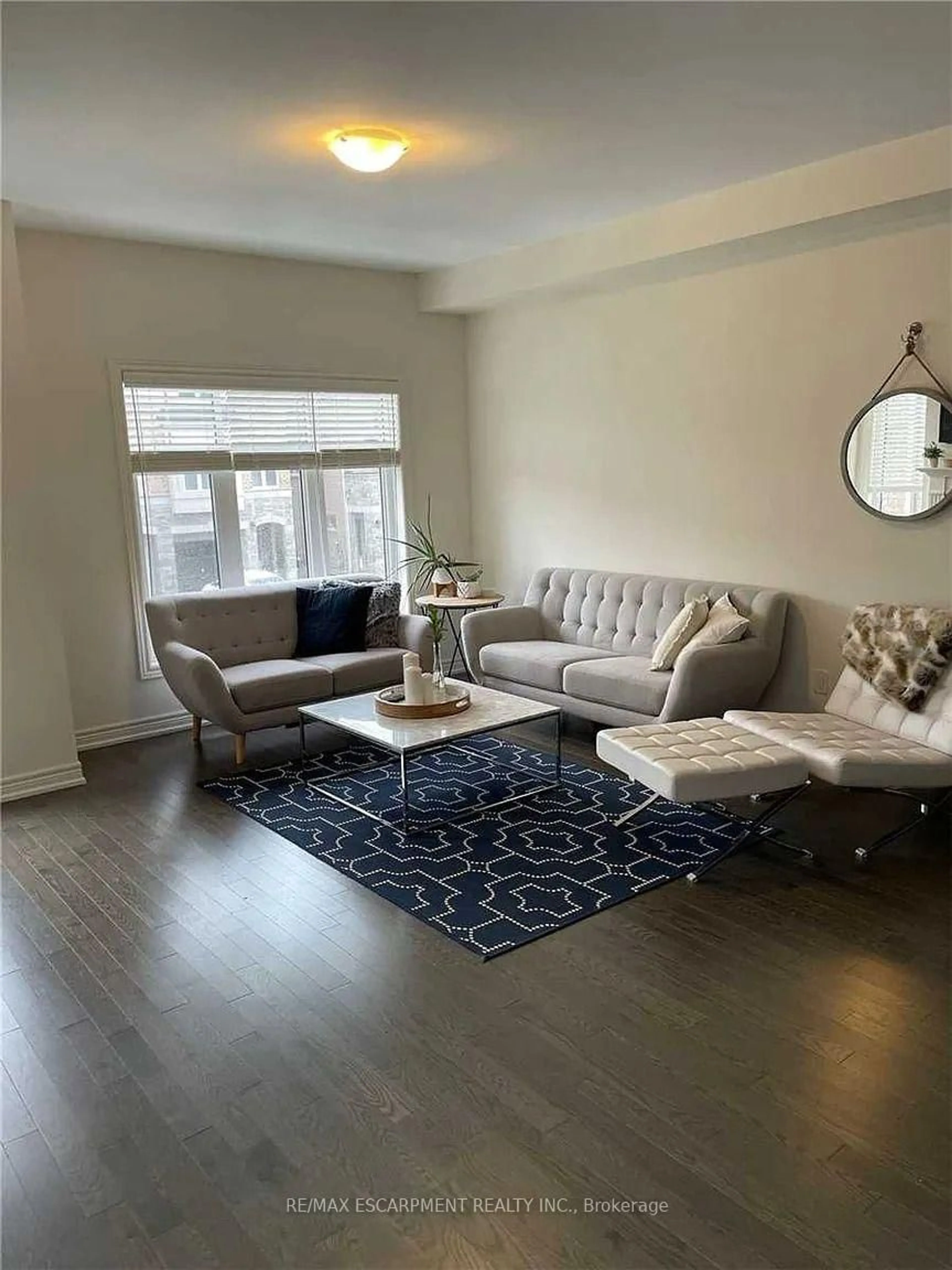 Living room with furniture, wood/laminate floor for 3930 Tufgar Cres, Burlington Ontario L7M 2A4