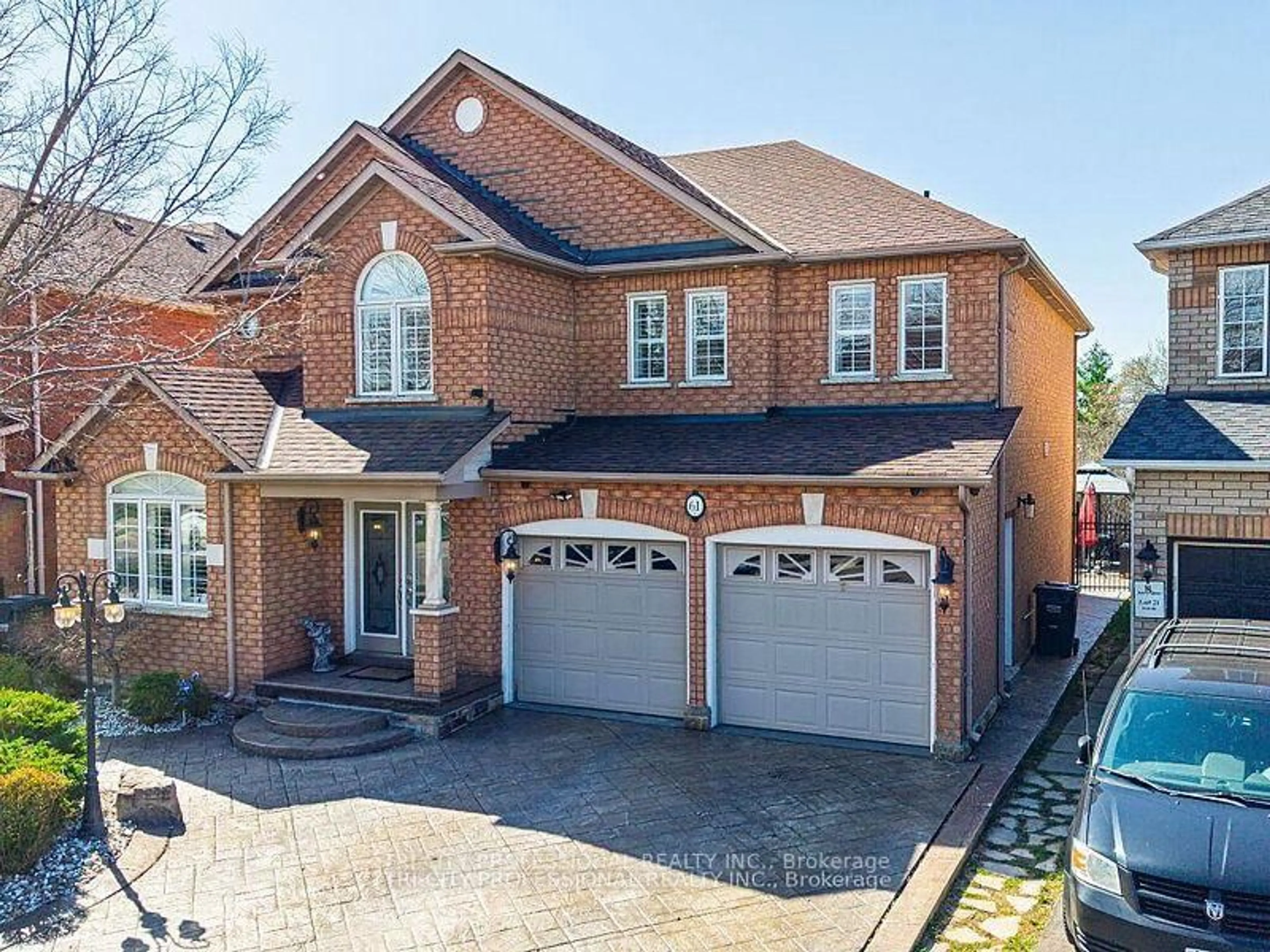 Home with brick exterior material, street for 61 Woodvalley Dr, Brampton Ontario L7A 1Z3