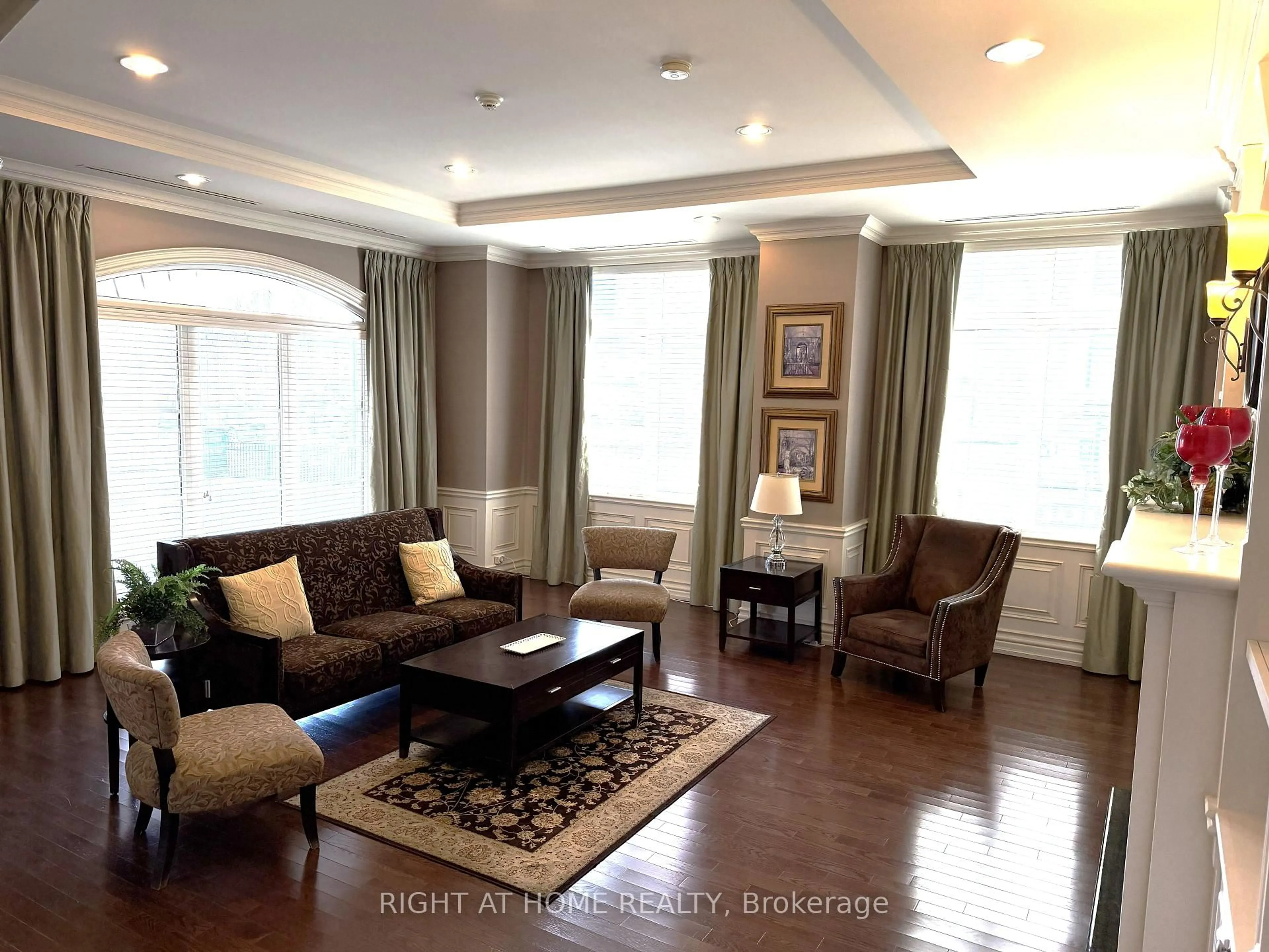 Living room with furniture, wood/laminate floor for 60 Ann St #309, Caledon Ontario L7E 4G5
