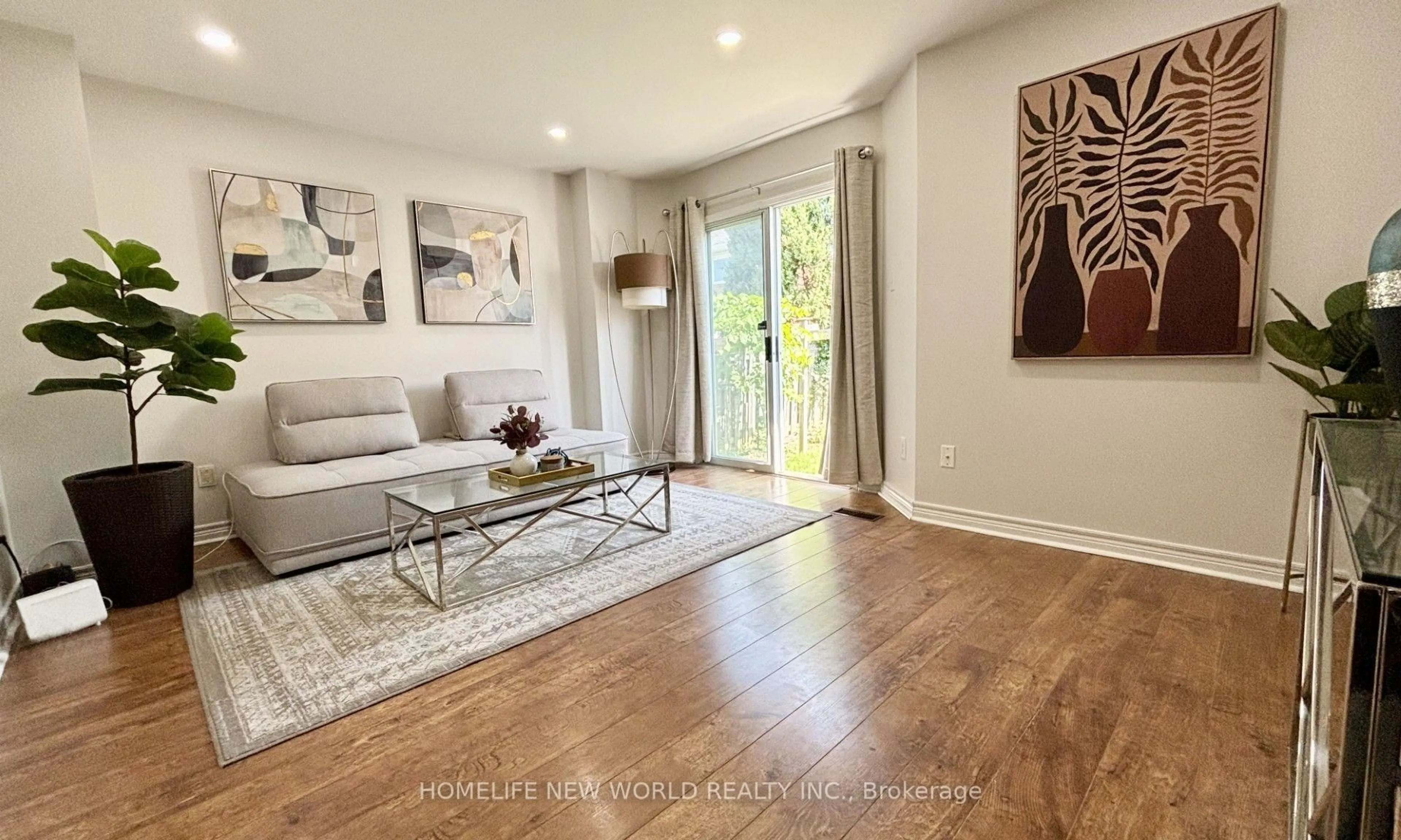 Living room with furniture, wood/laminate floor for 5666 Cortina Cres, Mississauga Ontario L4Z 3R4
