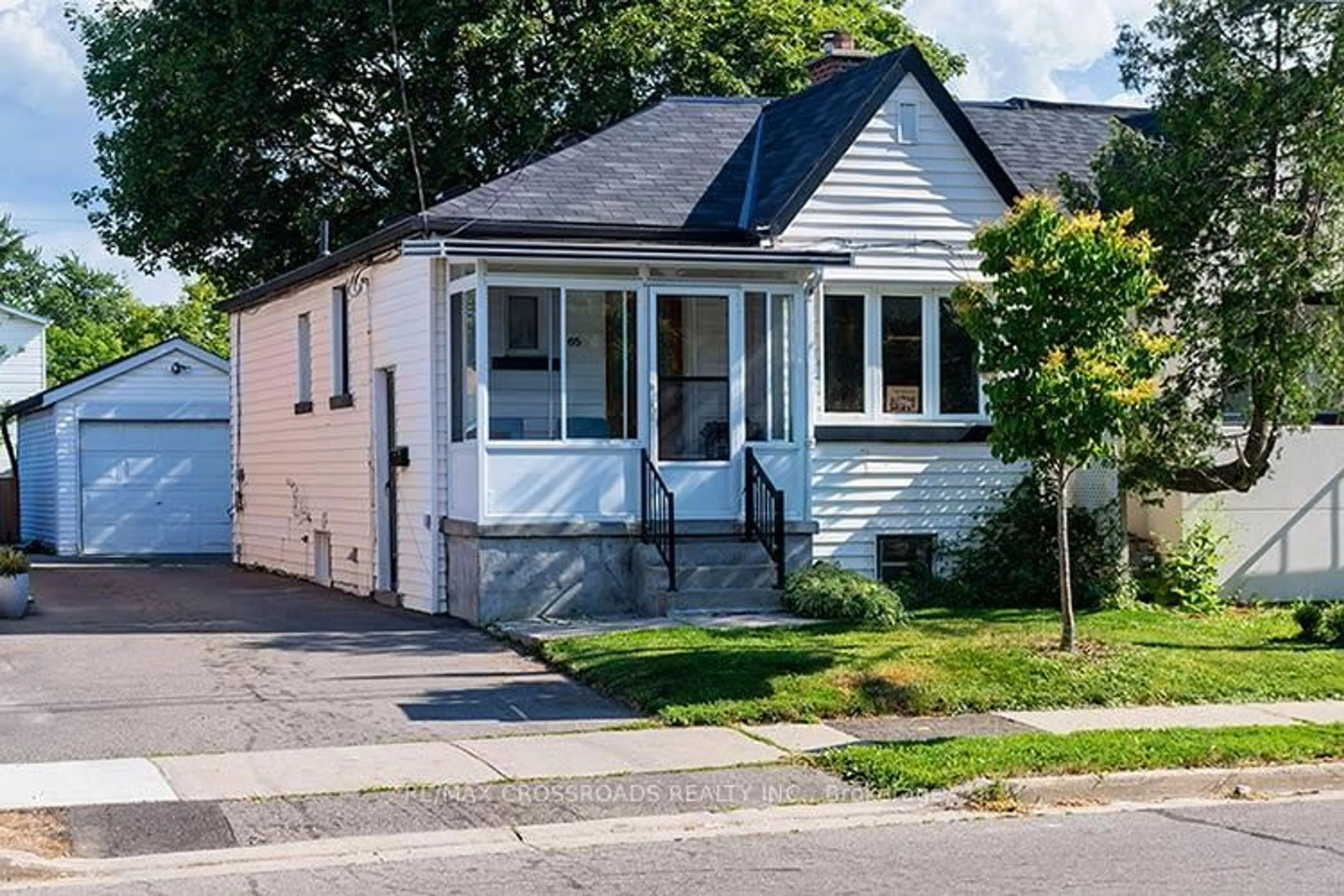 Home with vinyl exterior material, street for 65 Manitoba St, Toronto Ontario M8Y 1E1