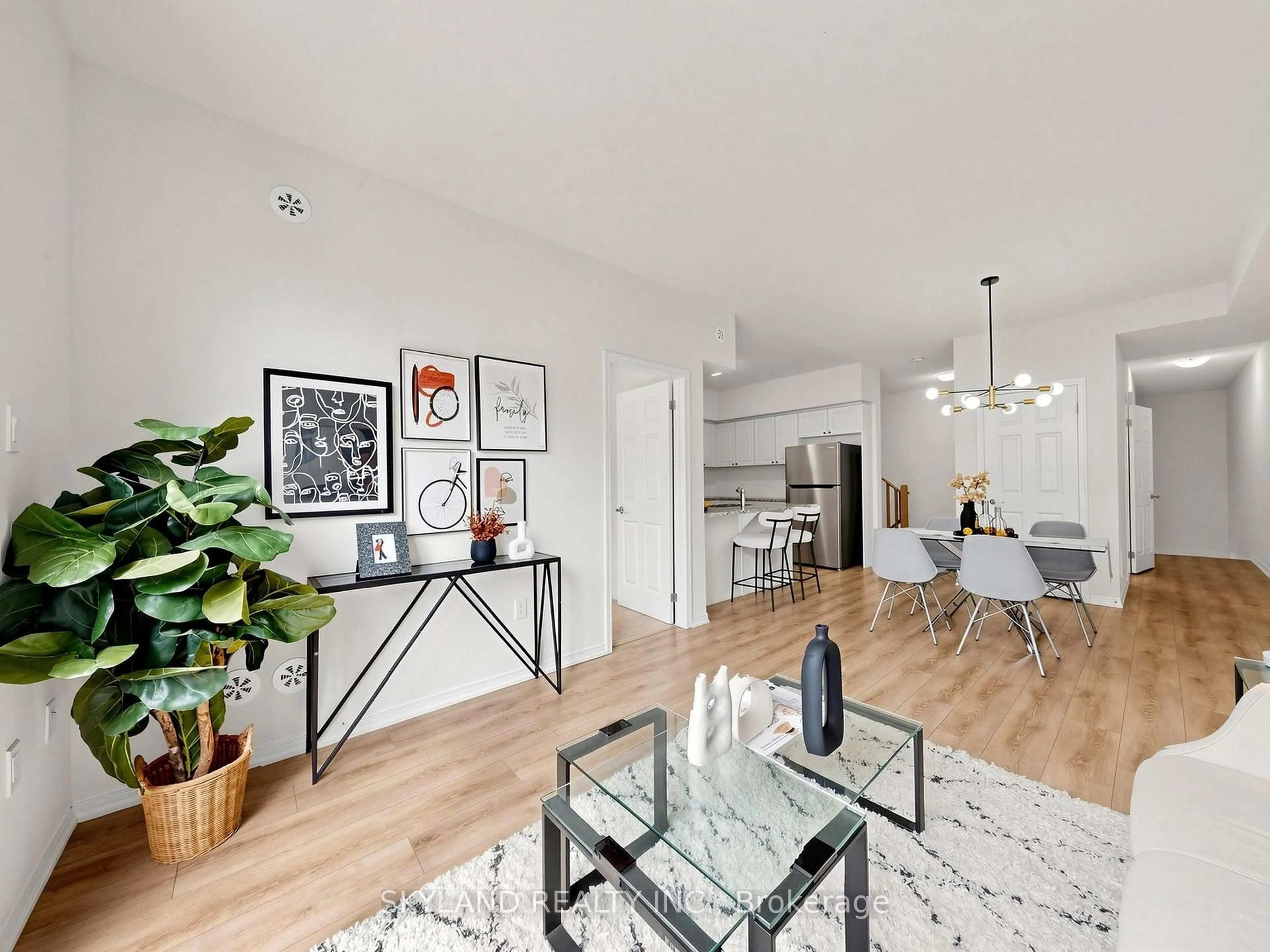 Living room with furniture, wood/laminate floor for 20 woodstream Dr #3, Toronto Ontario M9W 0G1