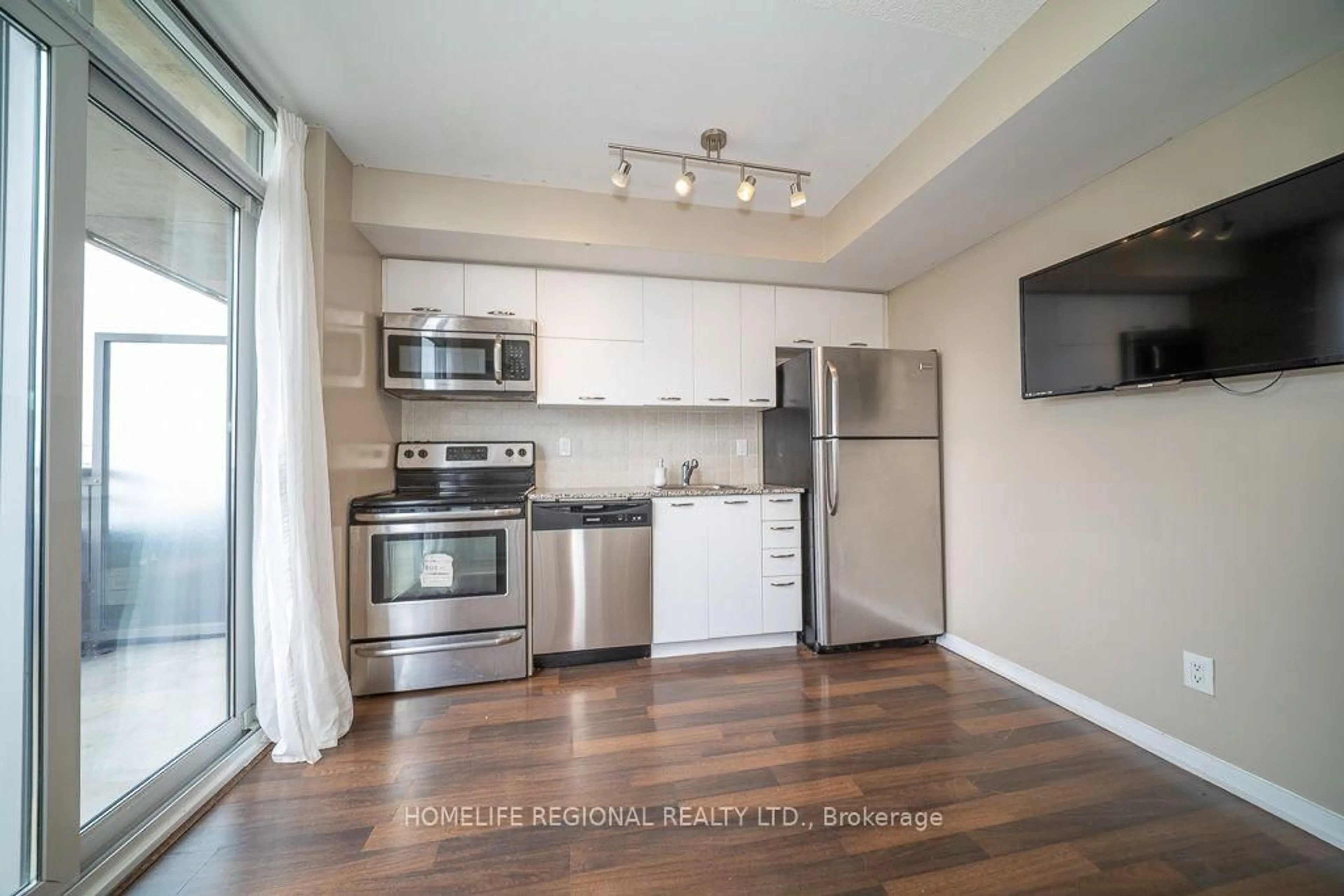 Standard kitchen, wood/laminate floor for 38 Joe Shuster Way #1520, Toronto Ontario M6K 0A5