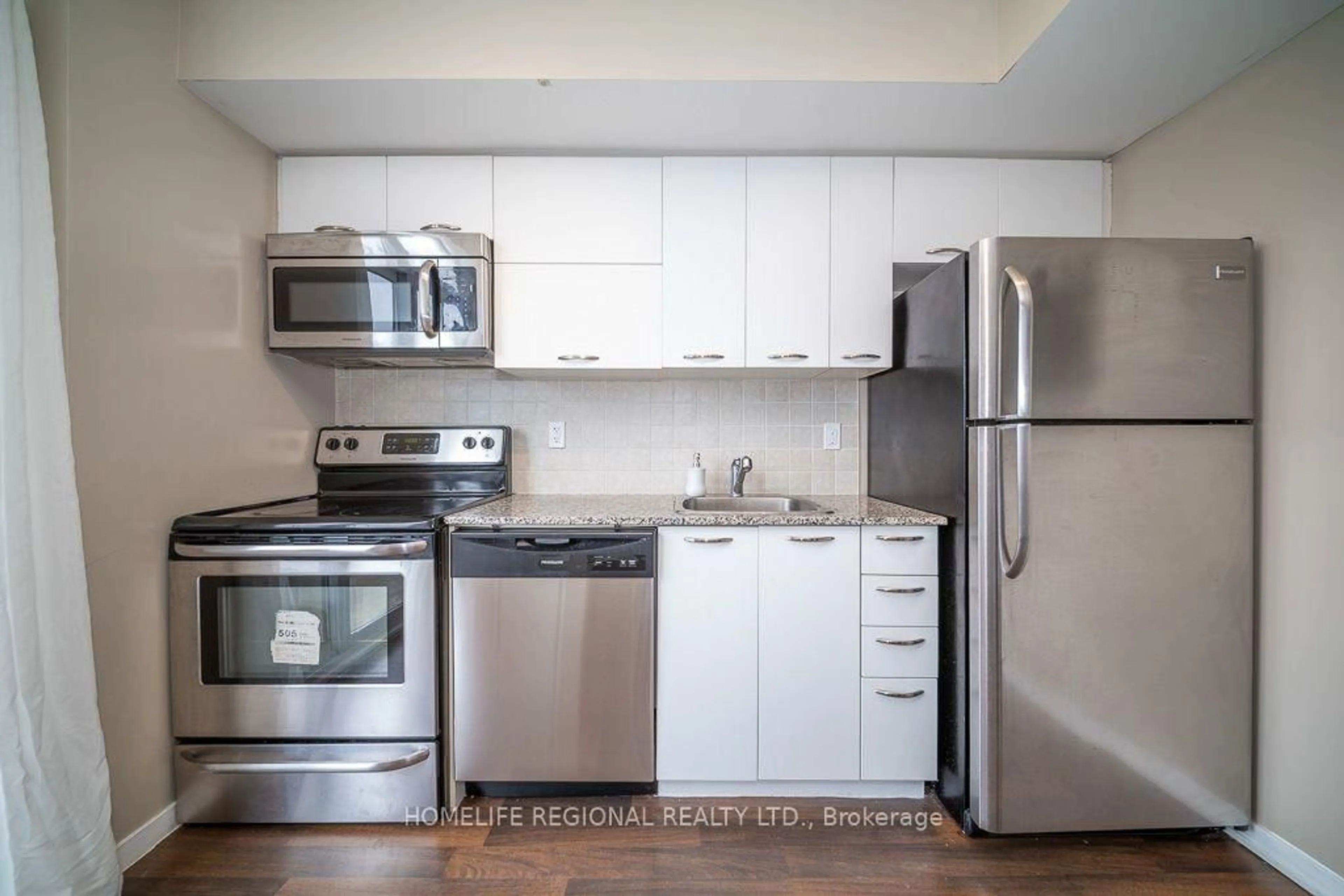 Standard kitchen, wood/laminate floor for 38 Joe Shuster Way #1520, Toronto Ontario M6K 0A5