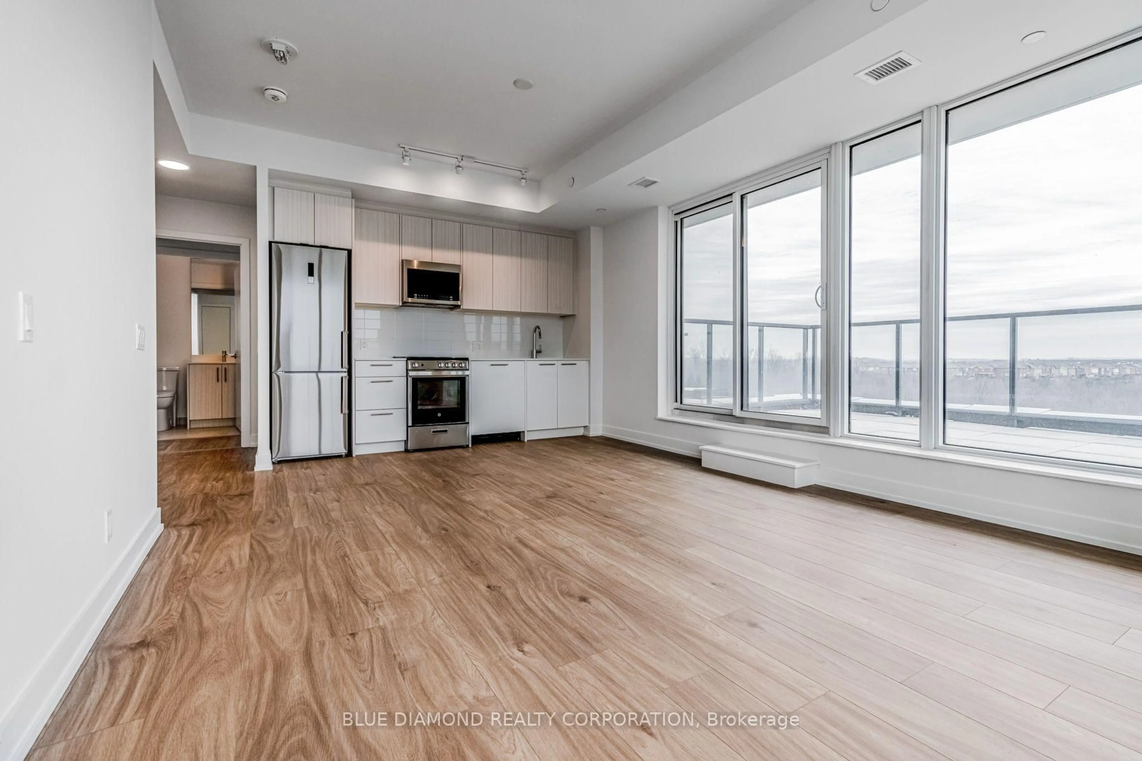Open concept kitchen, wood/laminate floor for 215 VETERANS Dr #408, Brampton Ontario L7A 5L6
