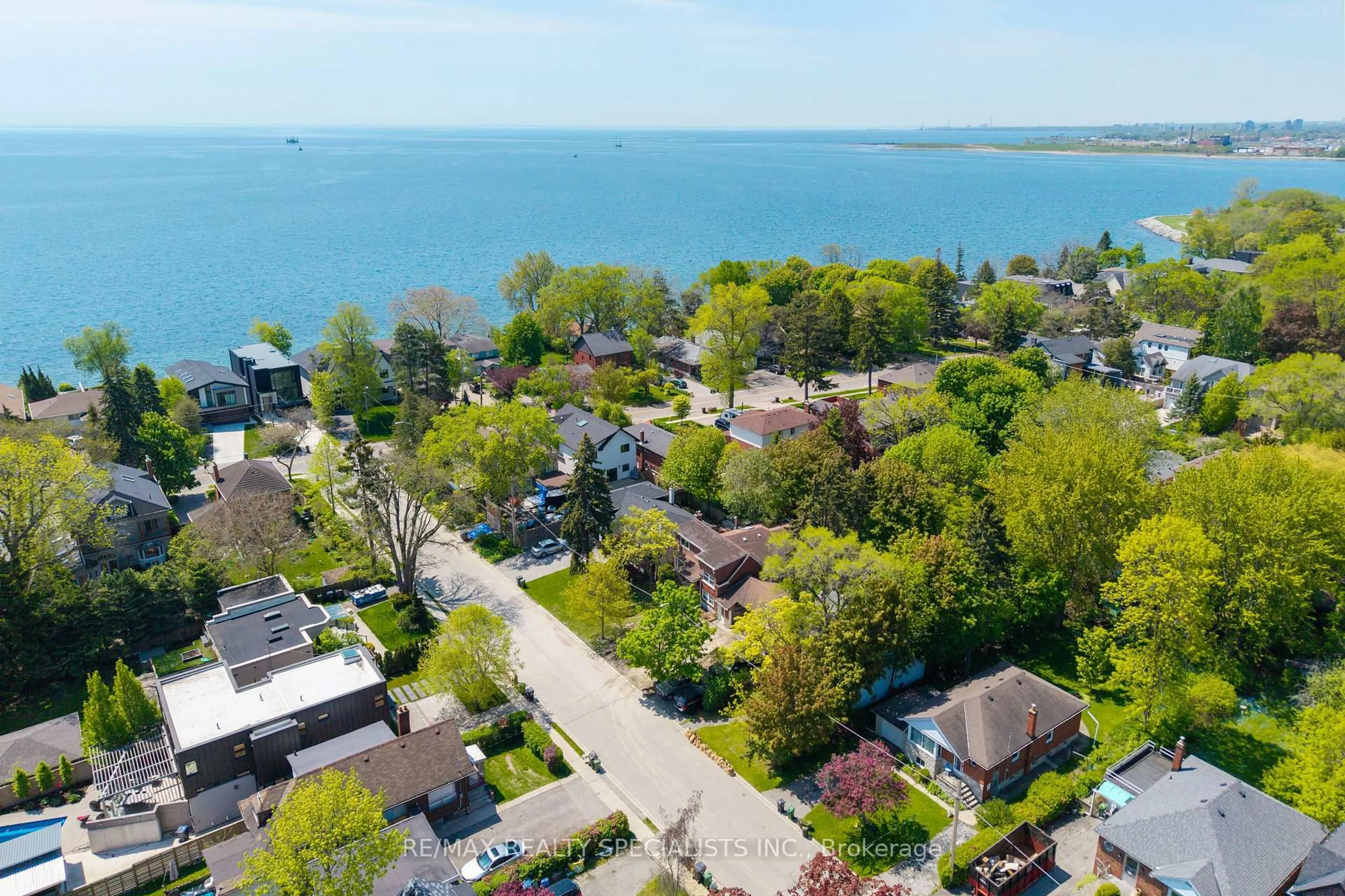 A pic from outside/outdoor area/front of a property/back of a property/a pic from drone, water/lake/river/ocean view for 4 Elton Cres, Toronto Ontario M8W 2X8