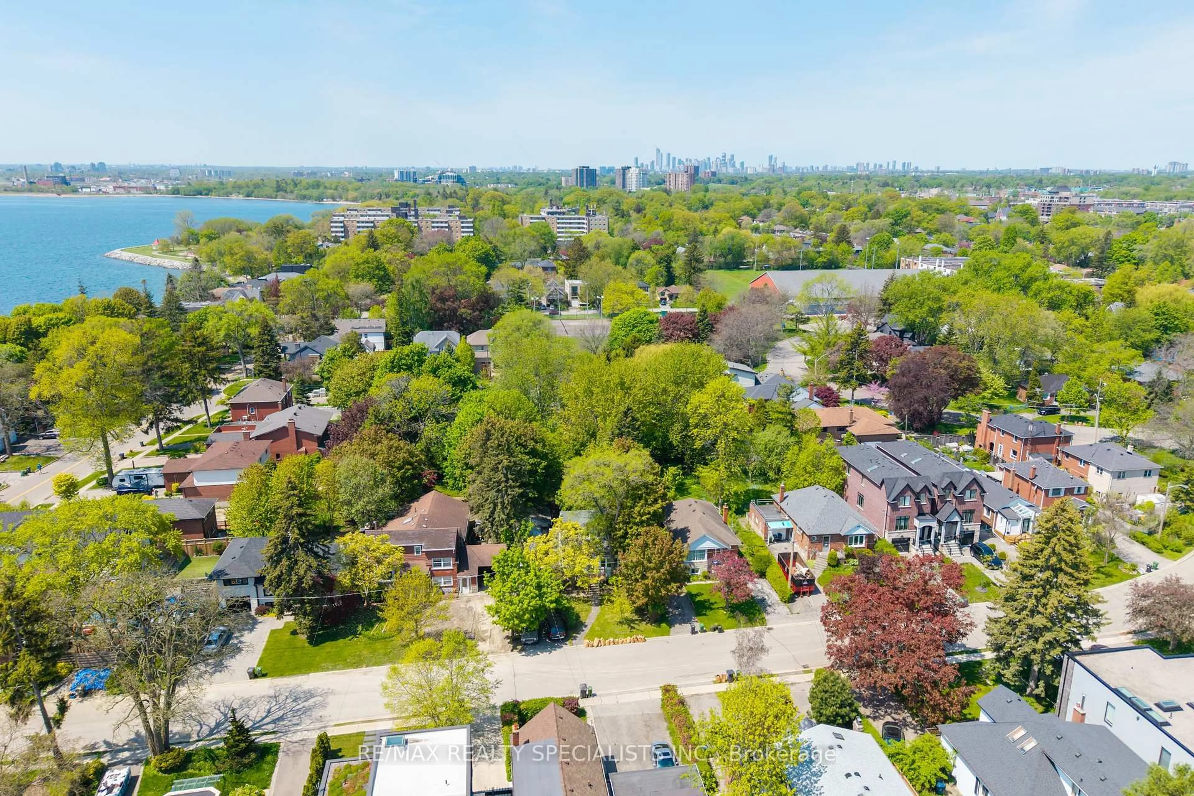 A pic from outside/outdoor area/front of a property/back of a property/a pic from drone, water/lake/river/ocean view for 4 Elton Cres, Toronto Ontario M8W 2X8