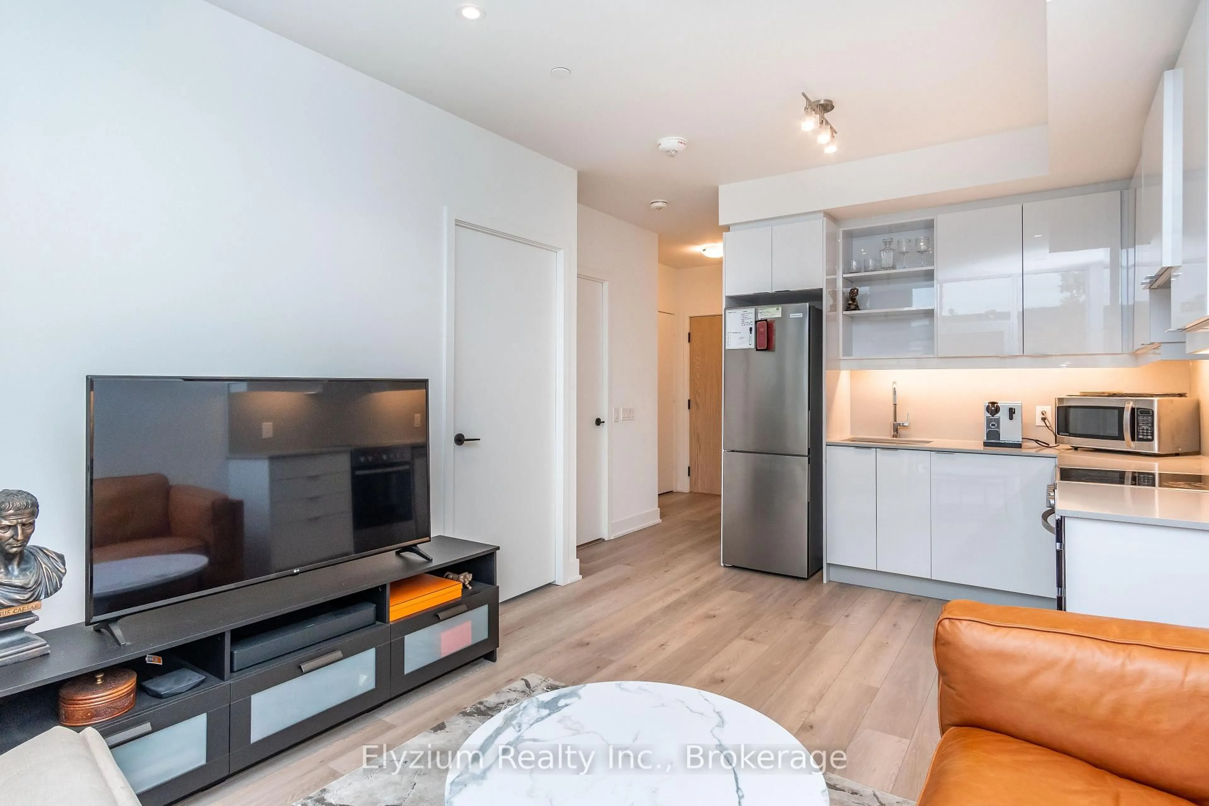 Living room with furniture, wood/laminate floor for 50 George Butchart Dr #112, Toronto Ontario M3K 2C5