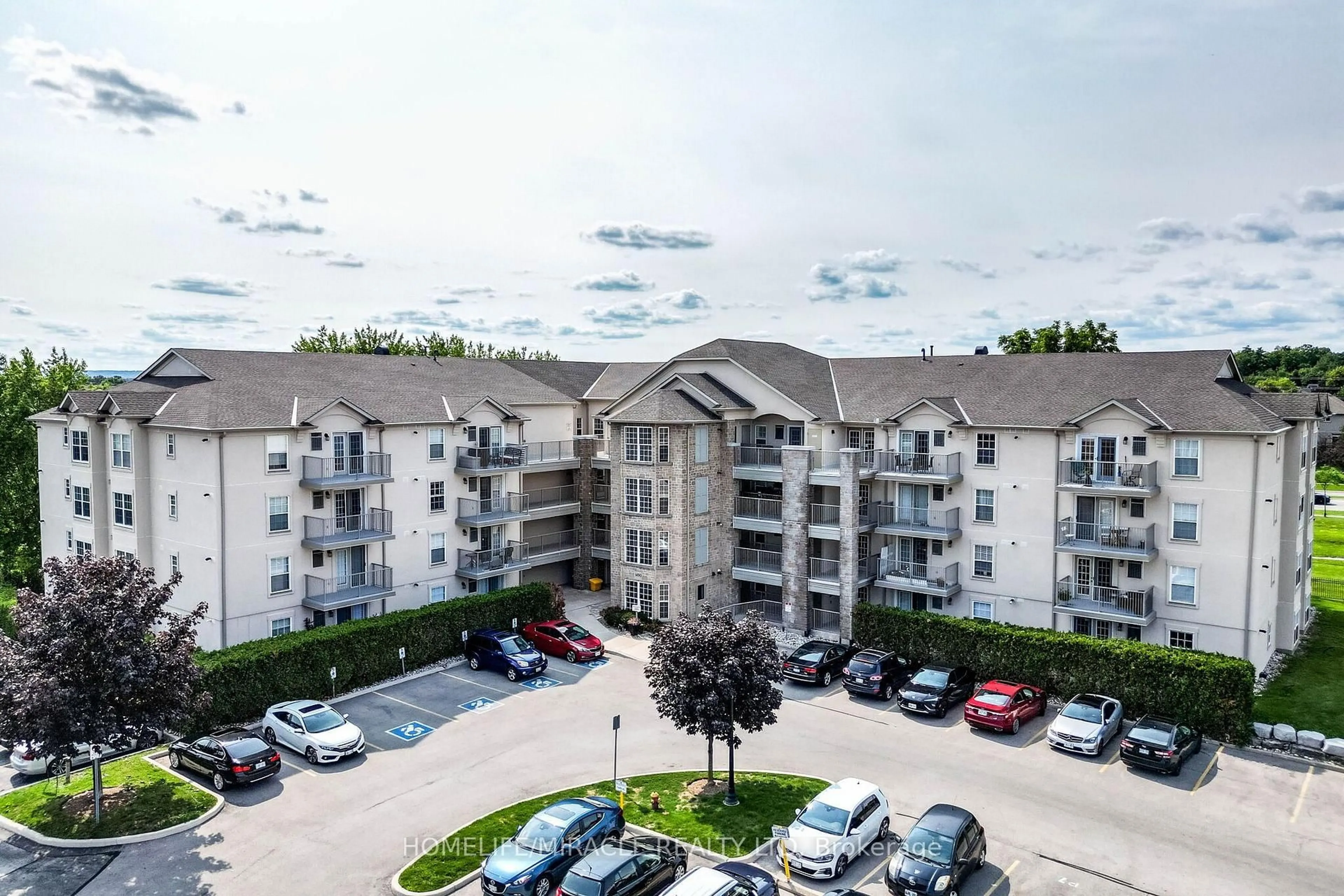 A pic from outside/outdoor area/front of a property/back of a property/a pic from drone, mountain view for 1490 Bishops Gate #305, Oakville Ontario L6M 4N3