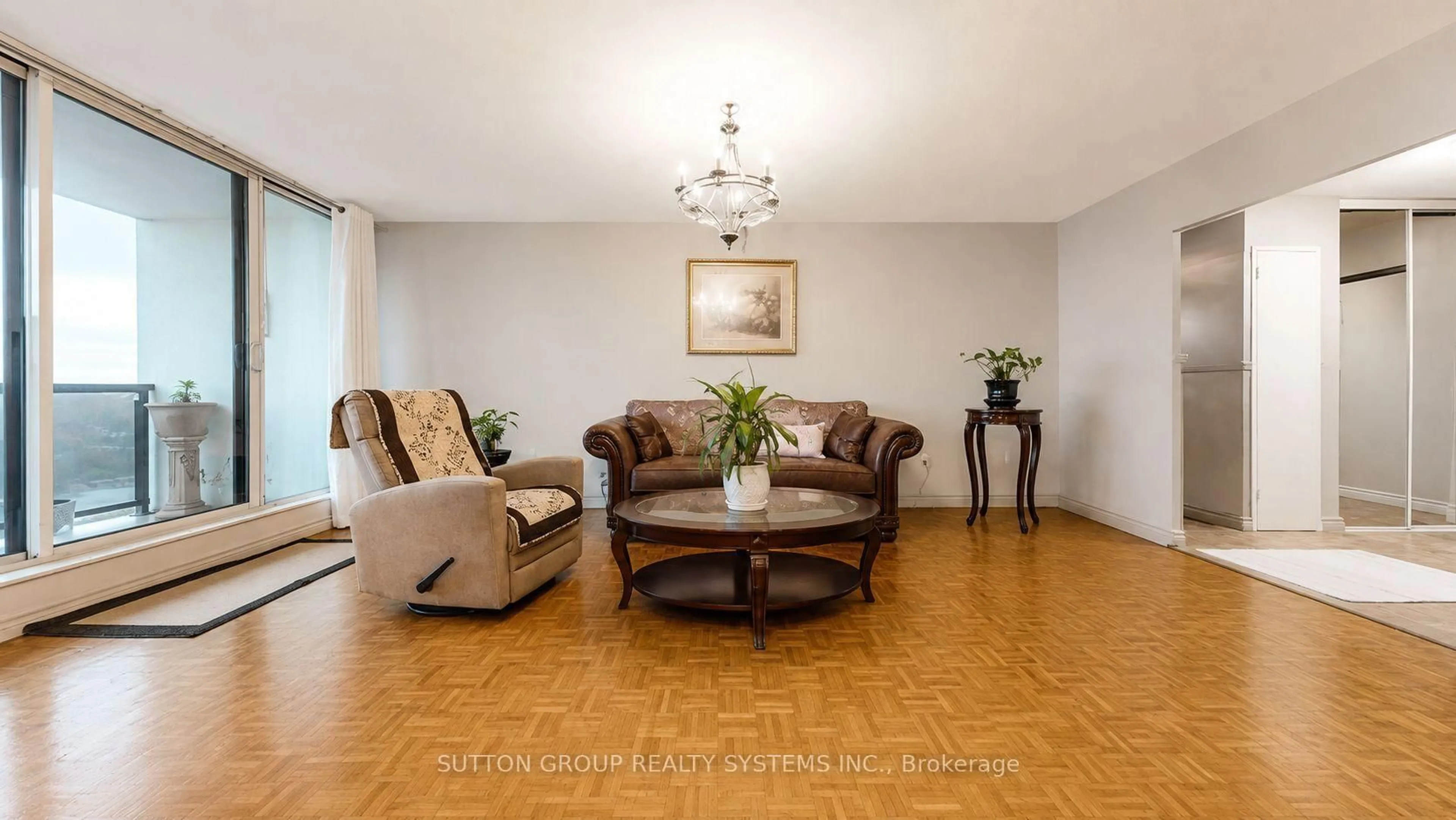 Living room with furniture, wood/laminate floor for 85 Emmett Ave #1811, Toronto Ontario M6M 5A2