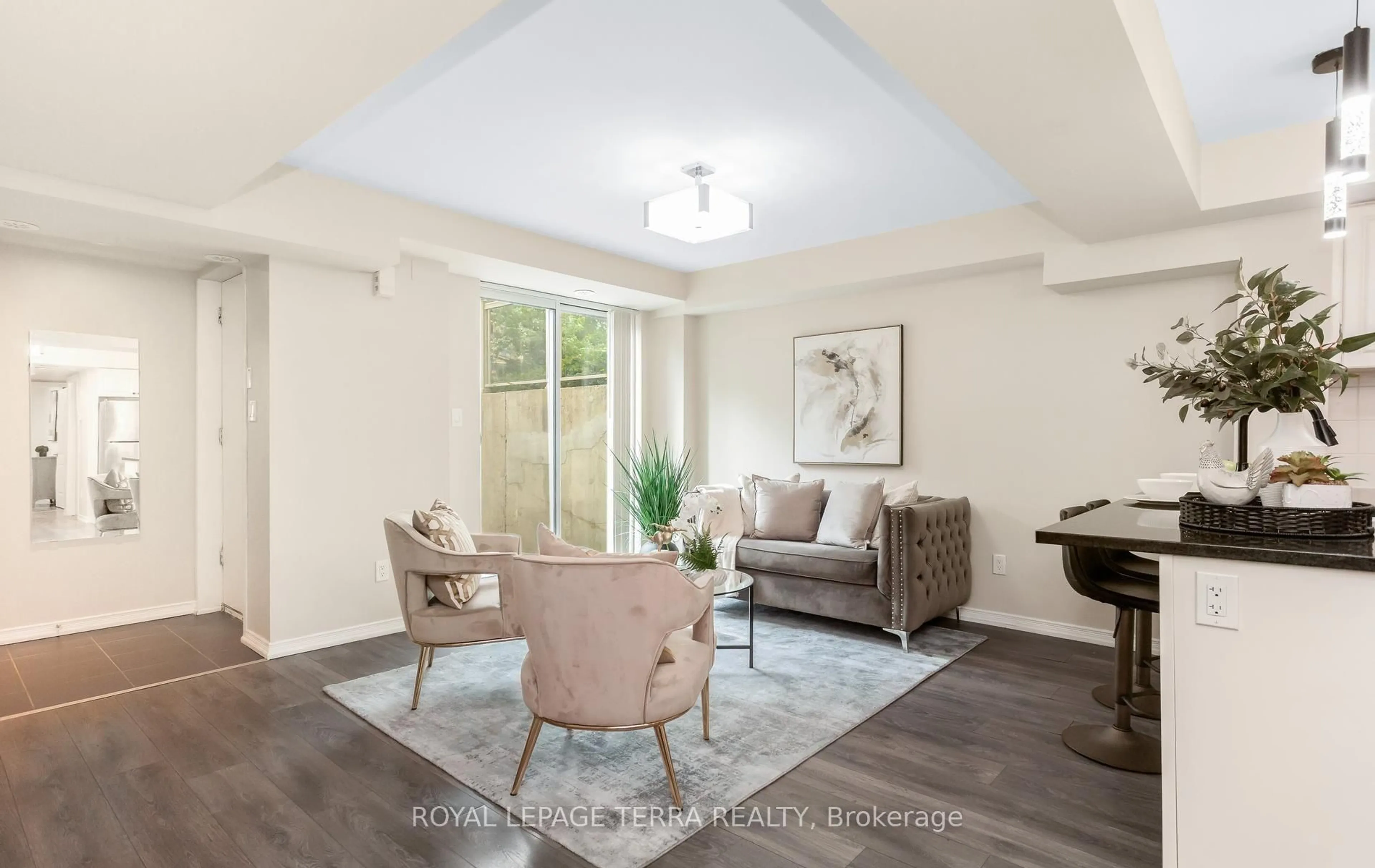 Living room with furniture, unknown for 3 Applewood Lane #101, Toronto Ontario M9C 0C1
