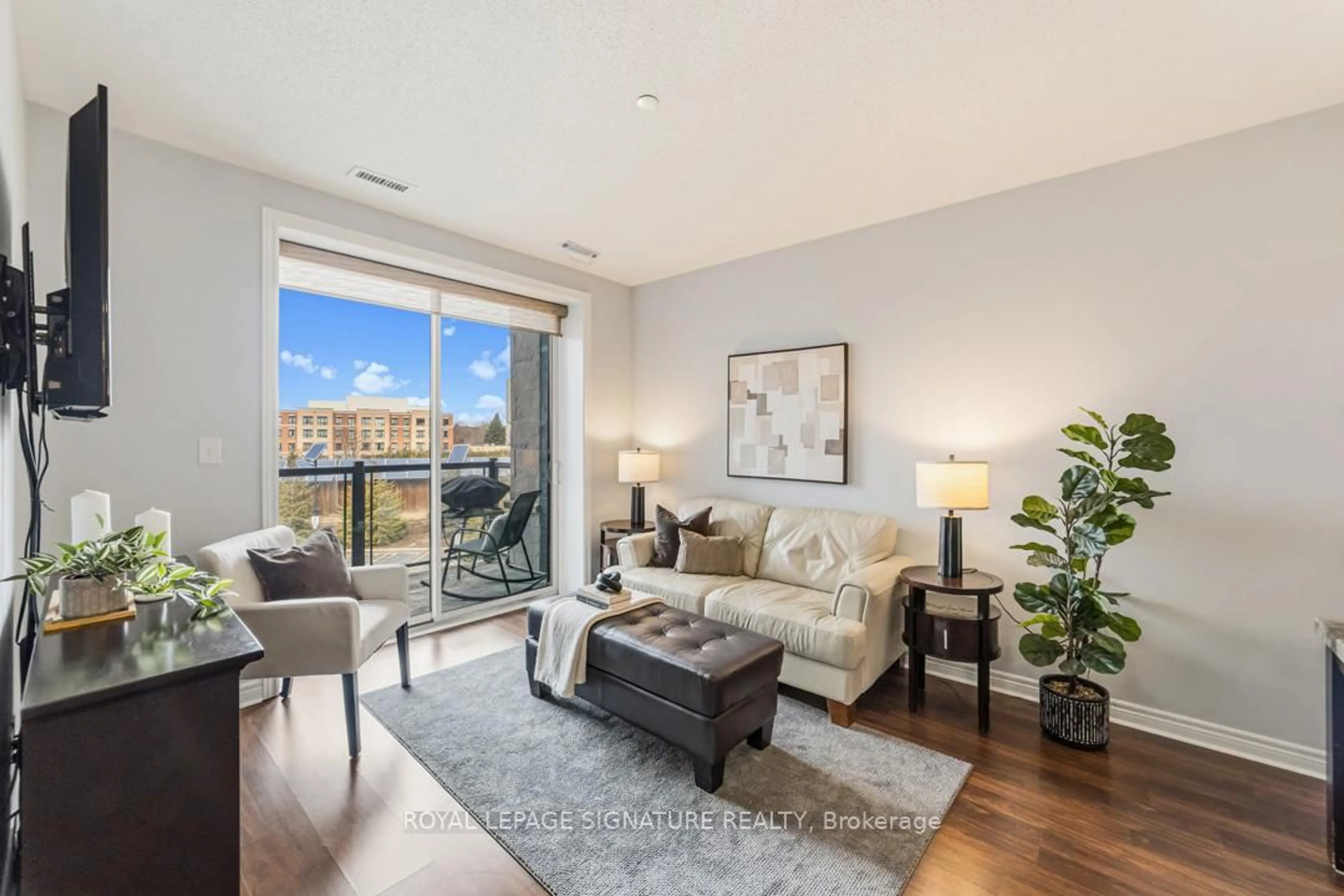 Living room with furniture, unknown for 383 Main St #319, Milton Ontario L9T 8K8