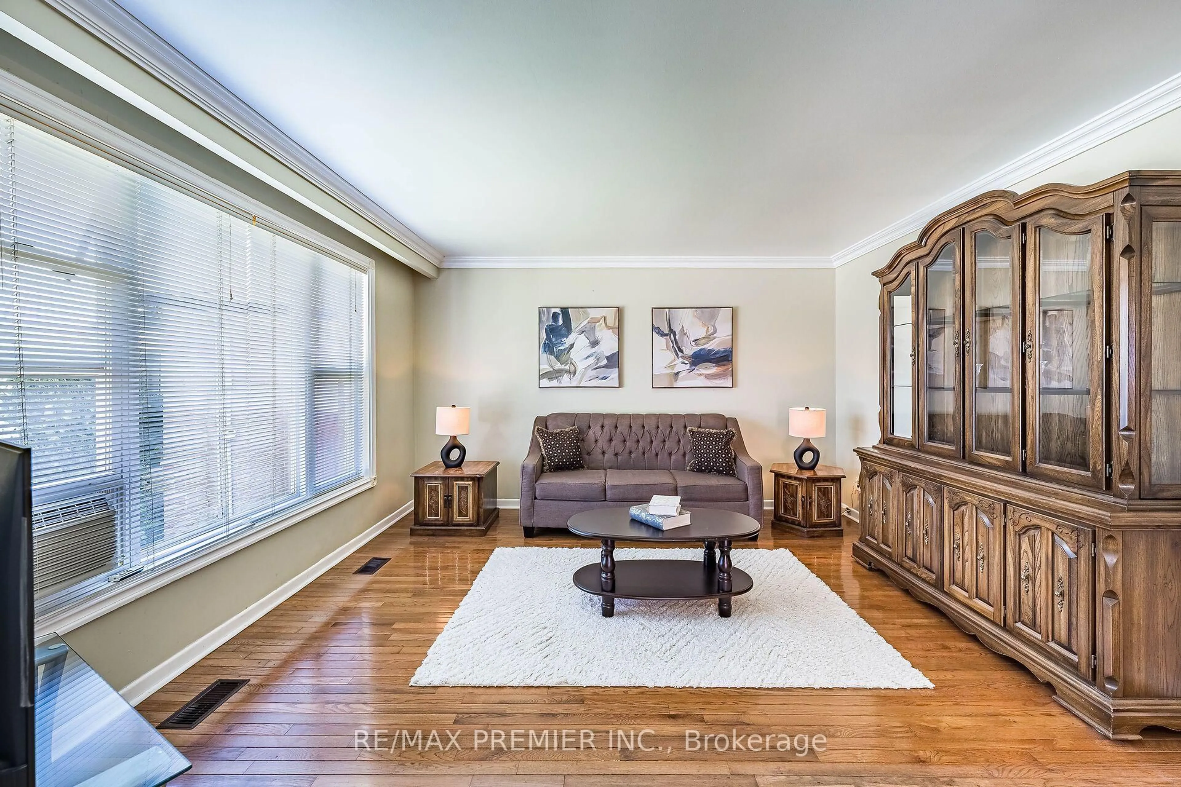 Living room with furniture, wood/laminate floor for 5 Valois Crt, Toronto Ontario M9V 2Z4