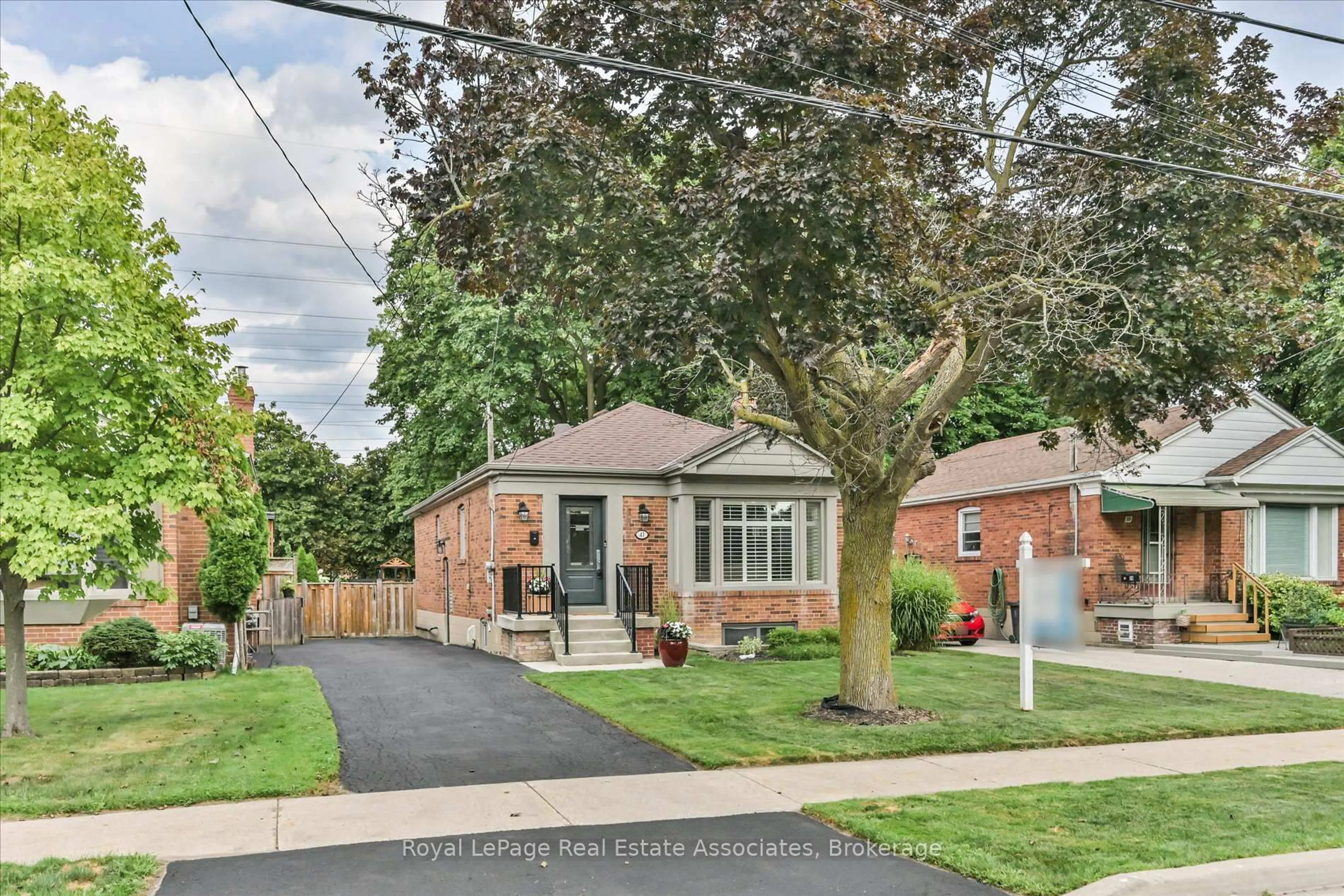 Home with brick exterior material, street for 41 Ashbourne Dr, Toronto Ontario M9B 4H3