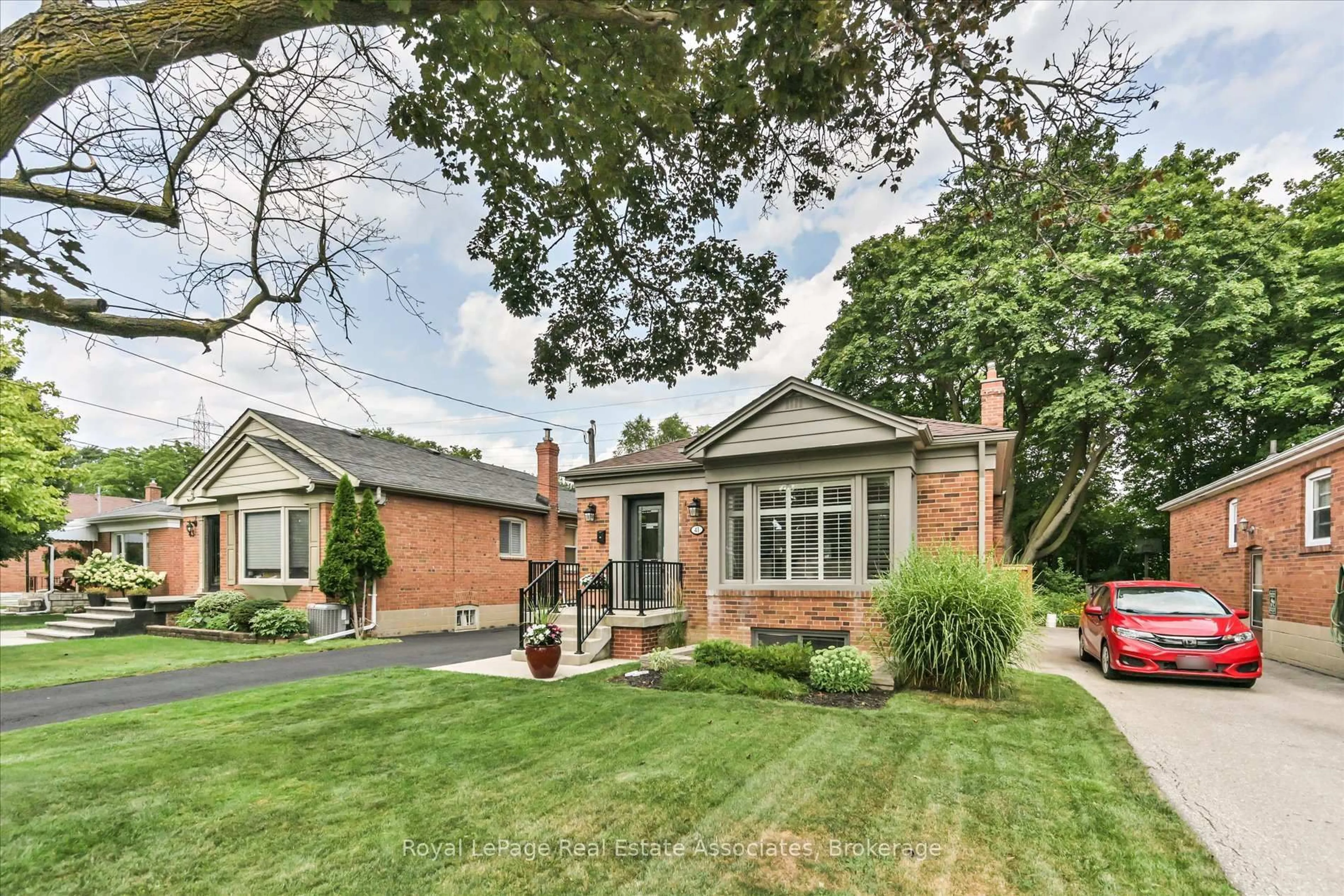 Home with brick exterior material, street for 41 Ashbourne Dr, Toronto Ontario M9B 4H3