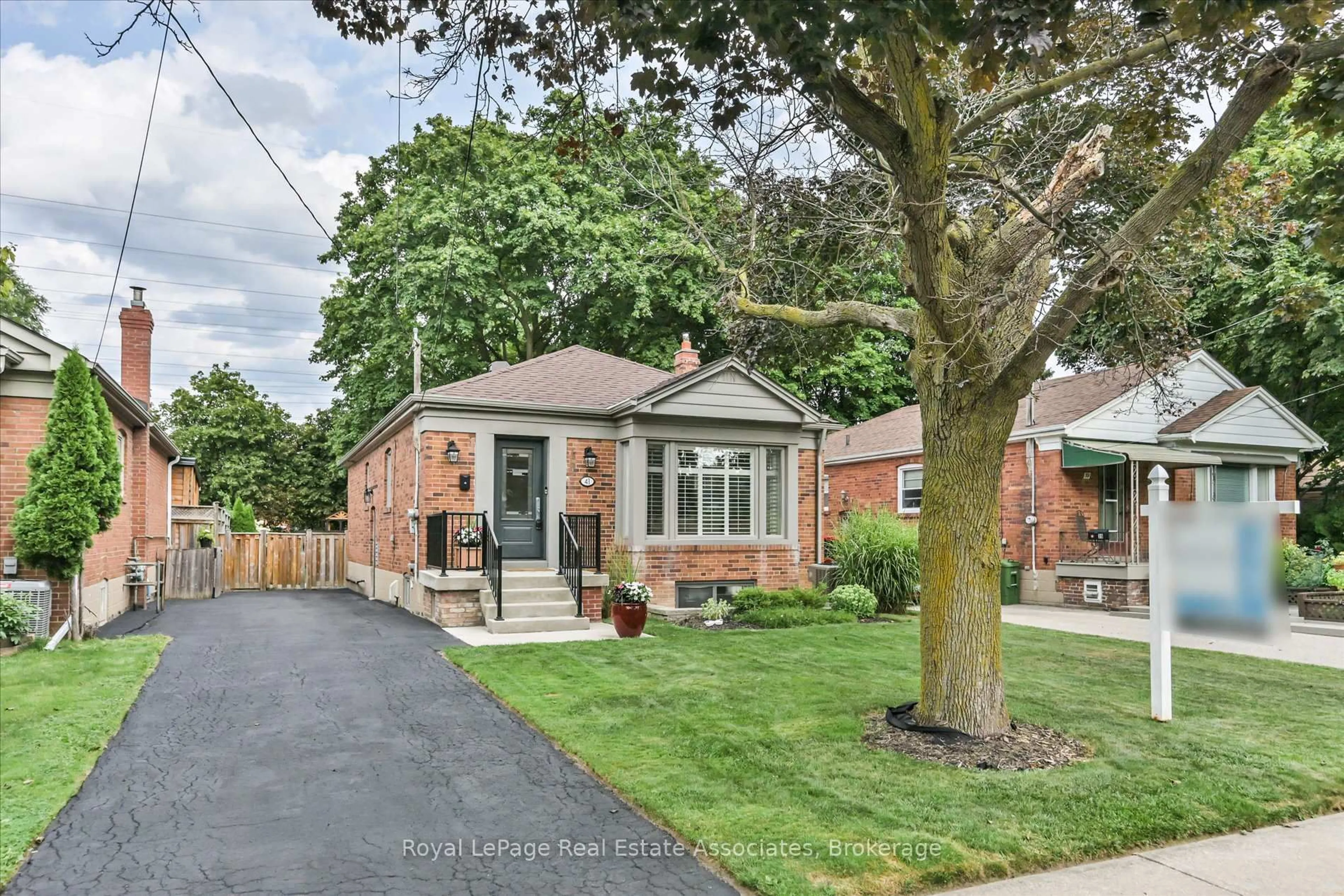 Home with brick exterior material, street for 41 Ashbourne Dr, Toronto Ontario M9B 4H3
