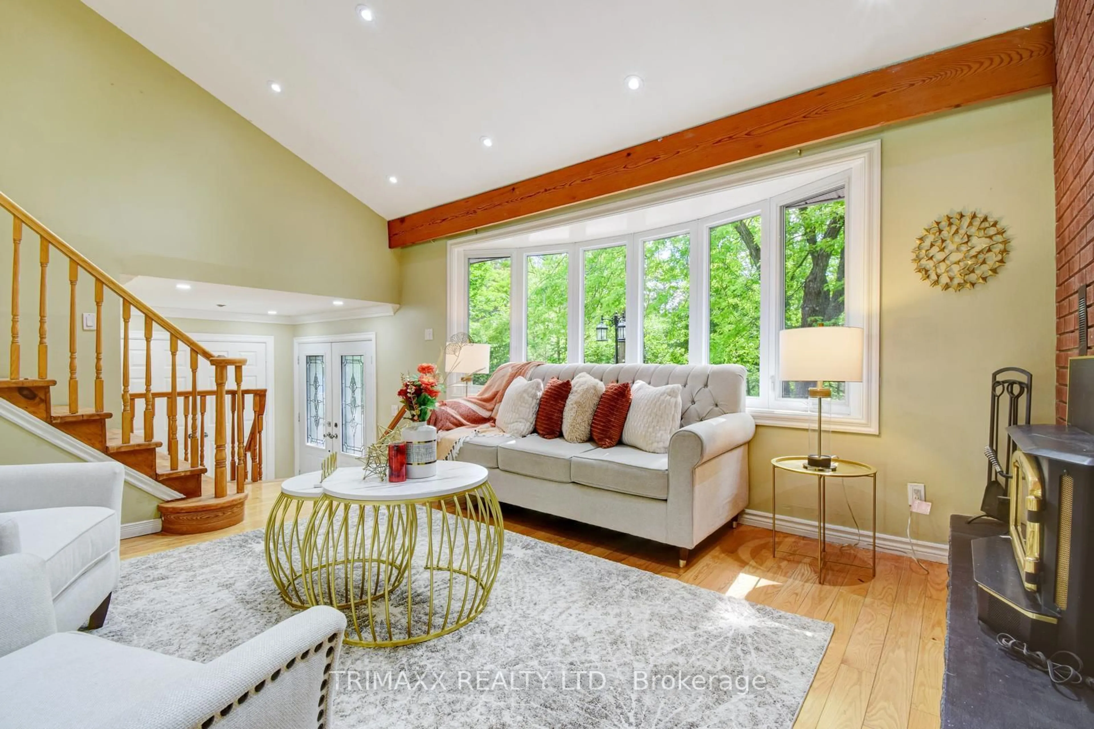 Living room with furniture, wood/laminate floor for 4069 Charleston Sdrd, Caledon Ontario L7K 0S6