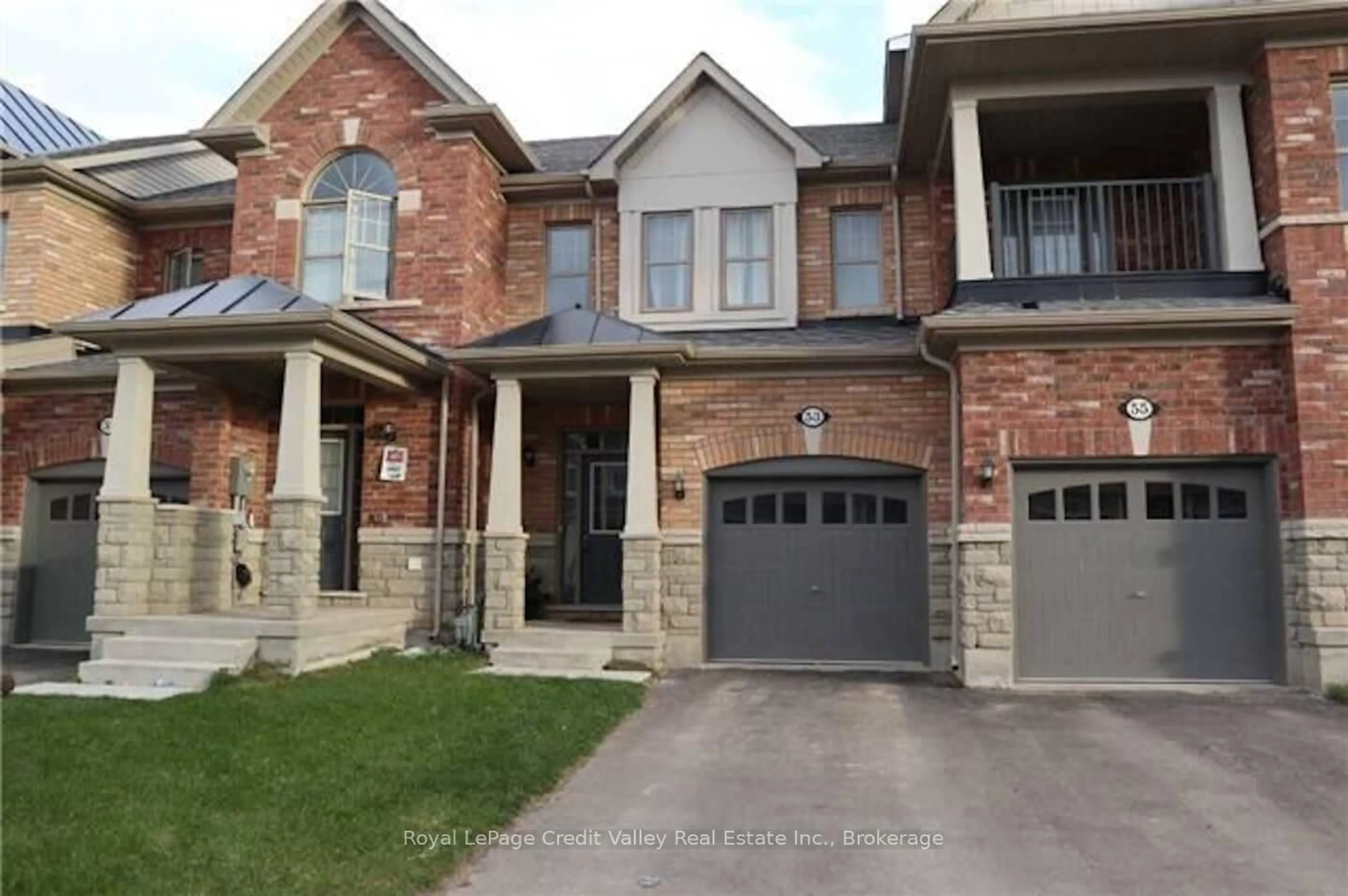 Home with brick exterior material, street for 53 Hogan Manor Dr, Brampton Ontario L7A 4V2