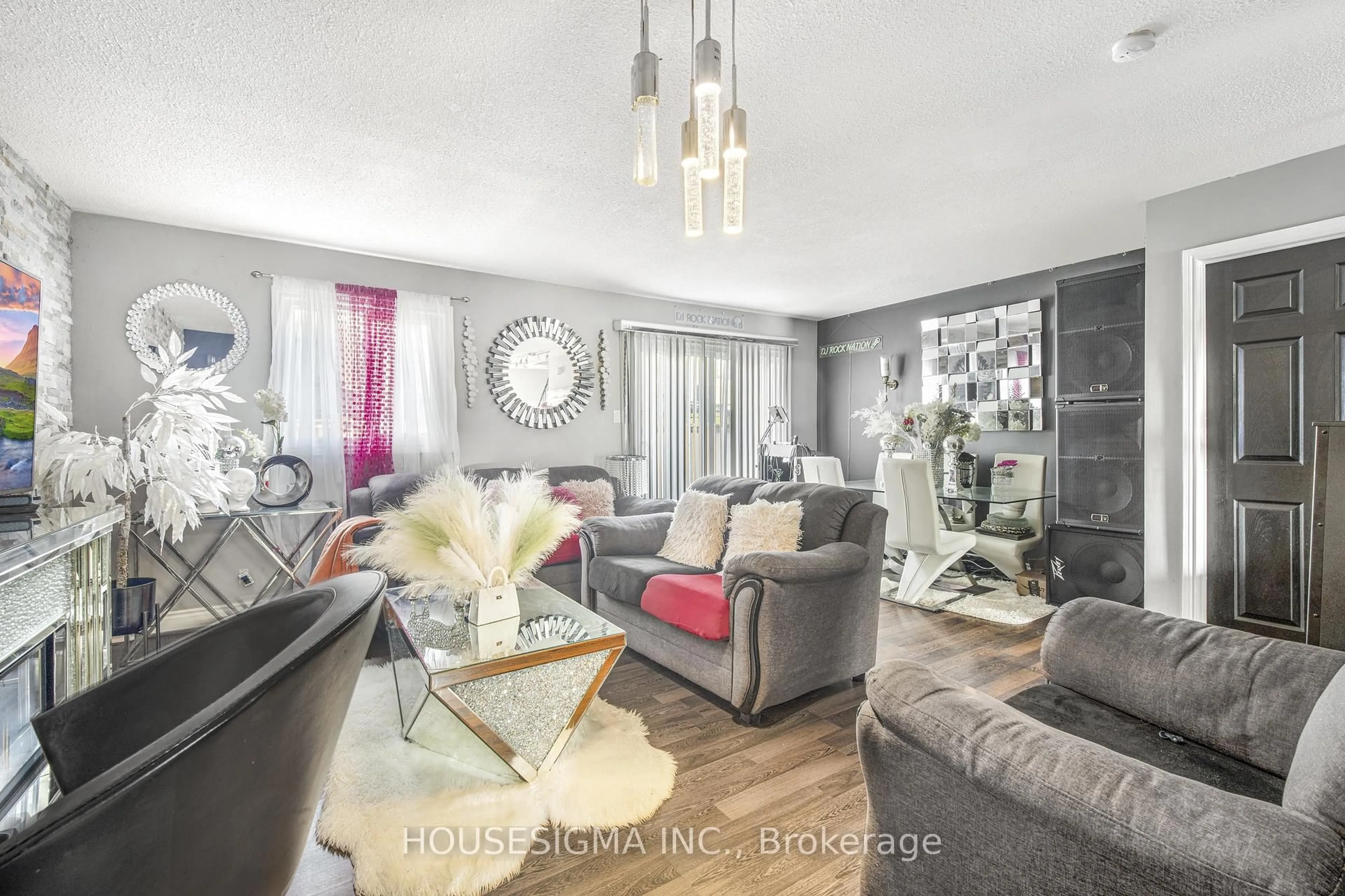 Living room with furniture, wood/laminate floor for 105 Hansen Rd #61, Brampton Ontario L6V 3C9