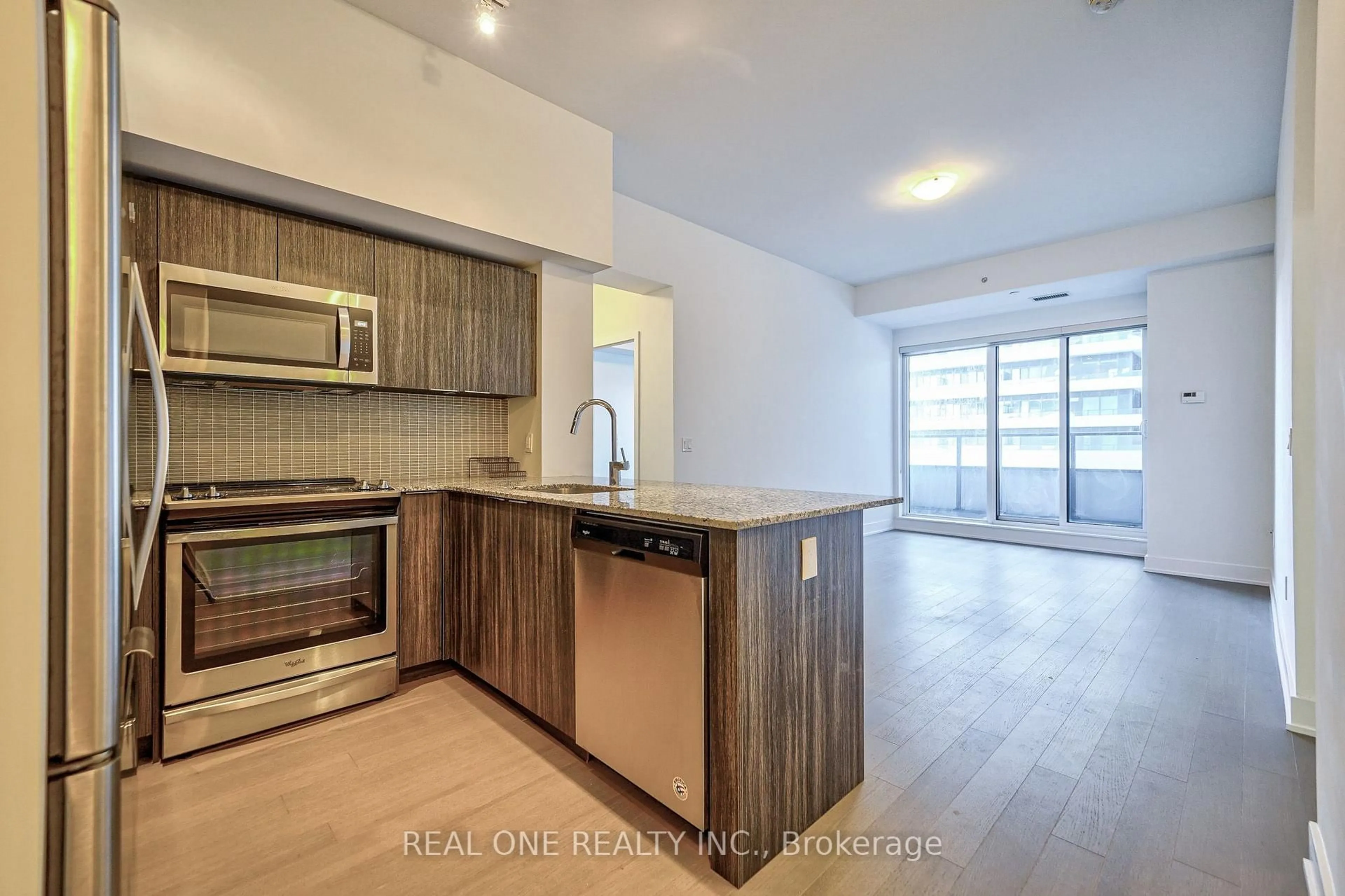 Open concept kitchen, wood/laminate floor for 30 Shore Breeze Dr #231, Toronto Ontario M8V 0J1