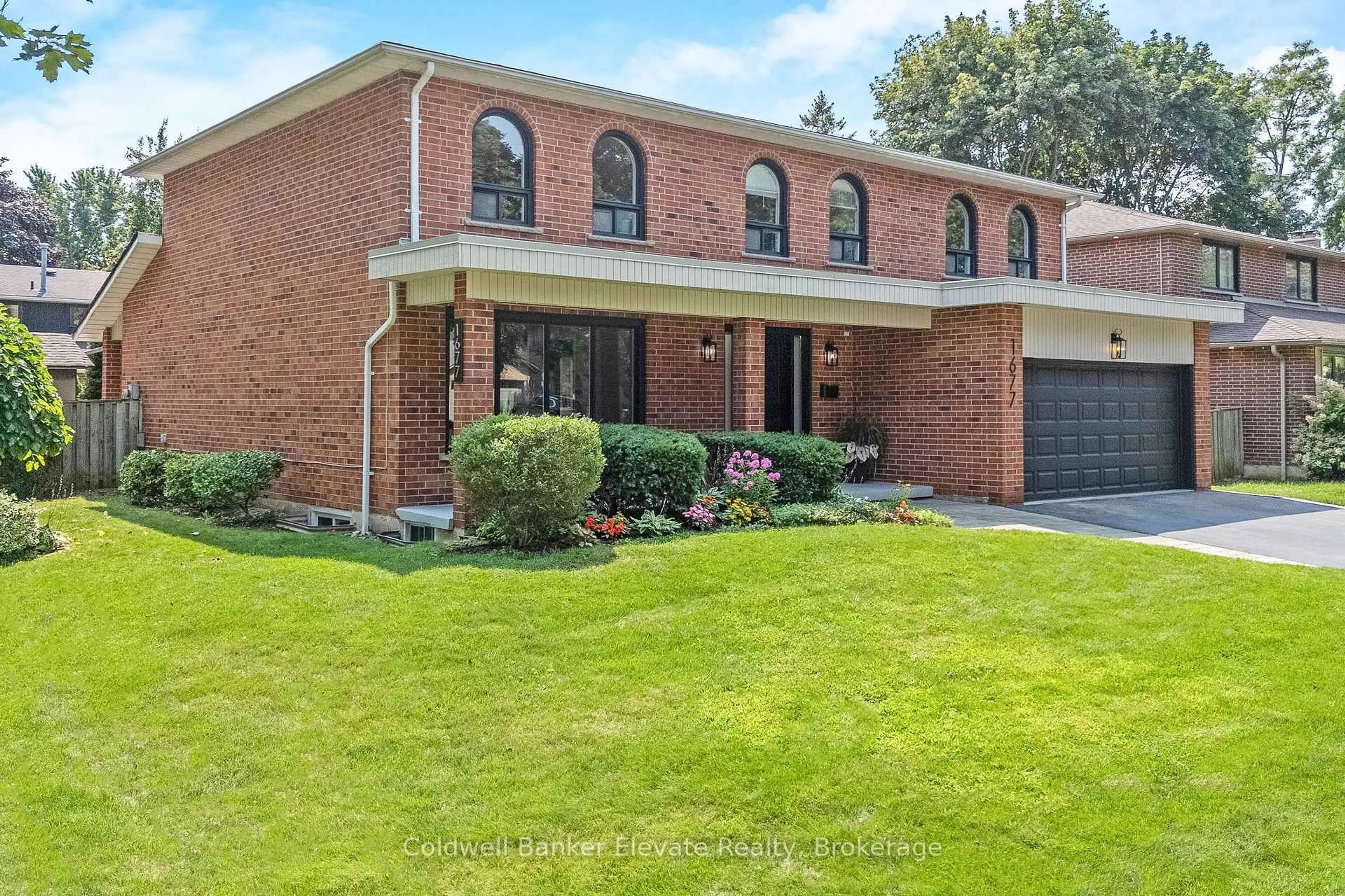 Home with brick exterior material, street for 1677 Sherwood Forrest Circ, Mississauga Ontario L5K 2G8