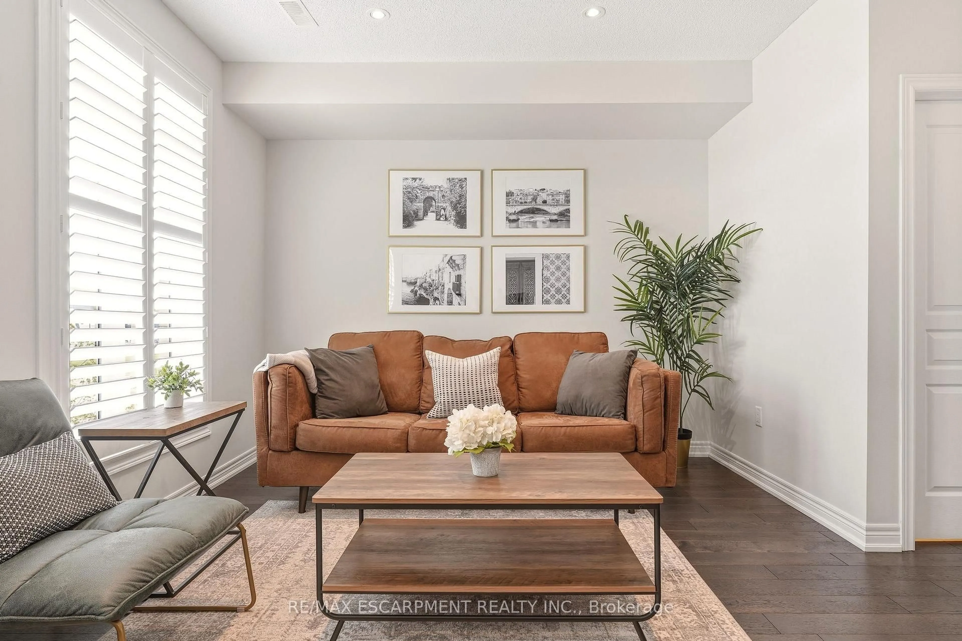 Living room with furniture, wood/laminate floor for 4171 Palermo Common #39, Burlington Ontario L7L 0G7