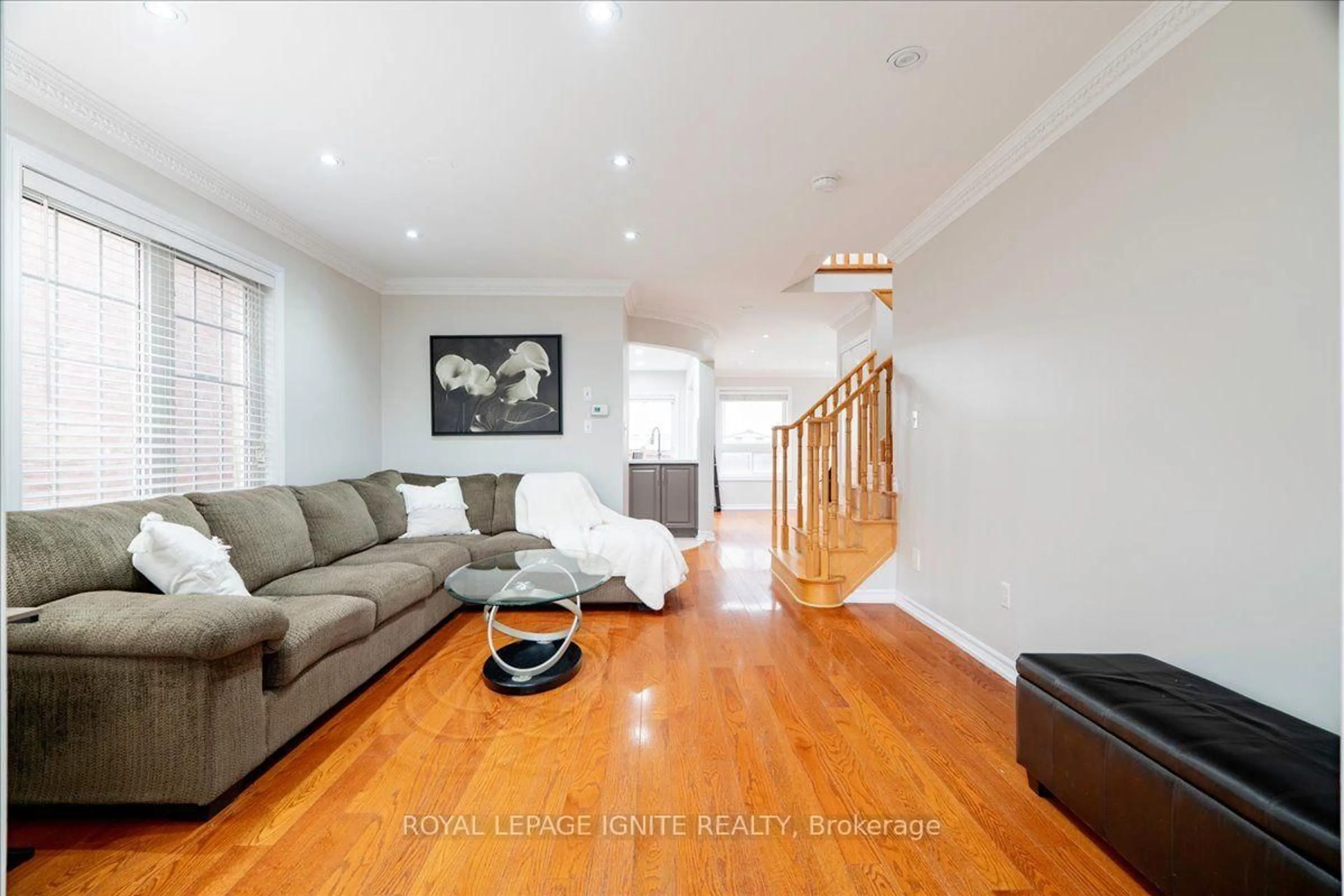 Living room with furniture, wood/laminate floor for 67 Severin St, Brampton Ontario L6R 0P3