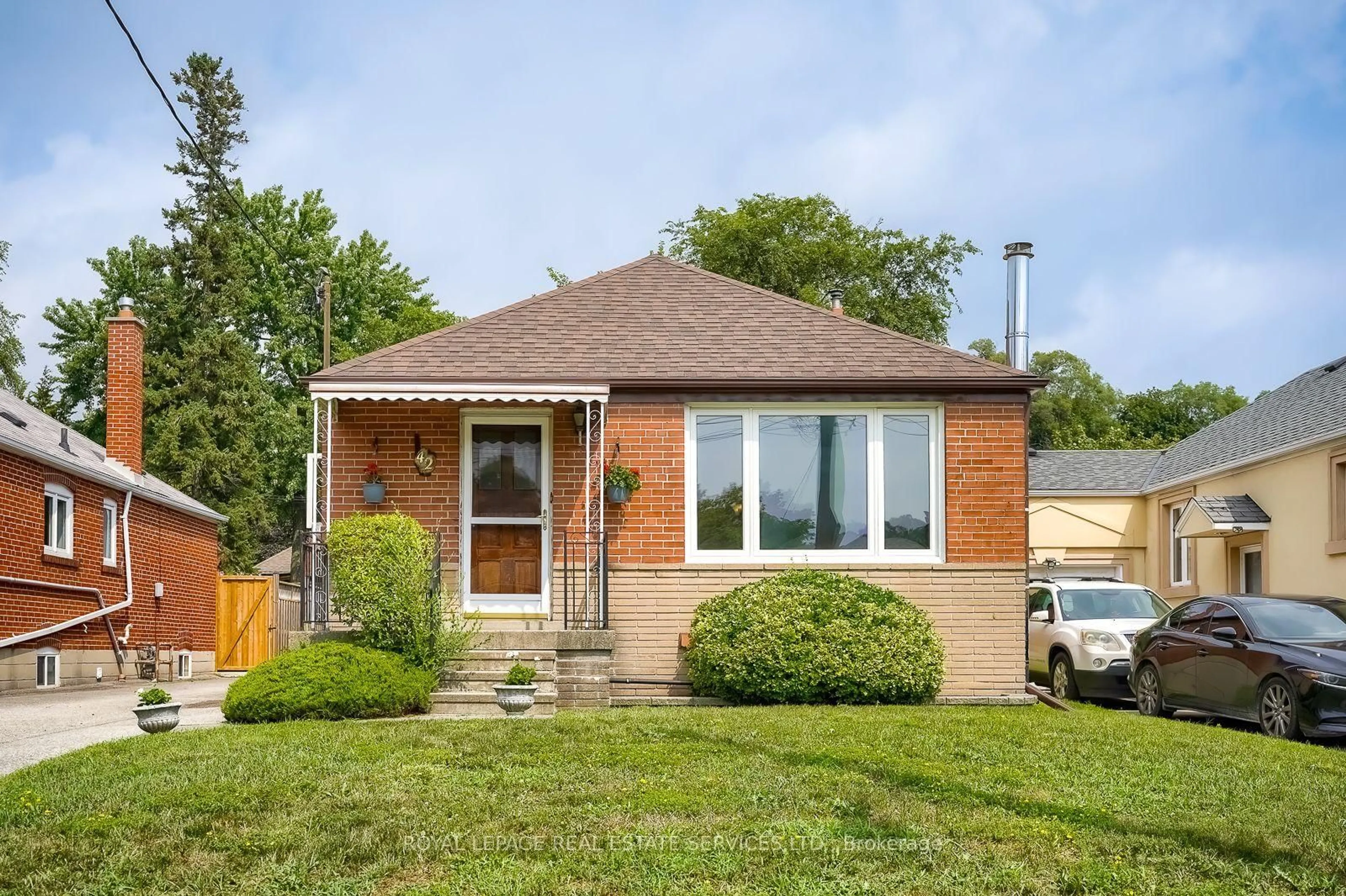 Home with brick exterior material, street for 42 Black Creek Blvd, Toronto Ontario M6N 2K8