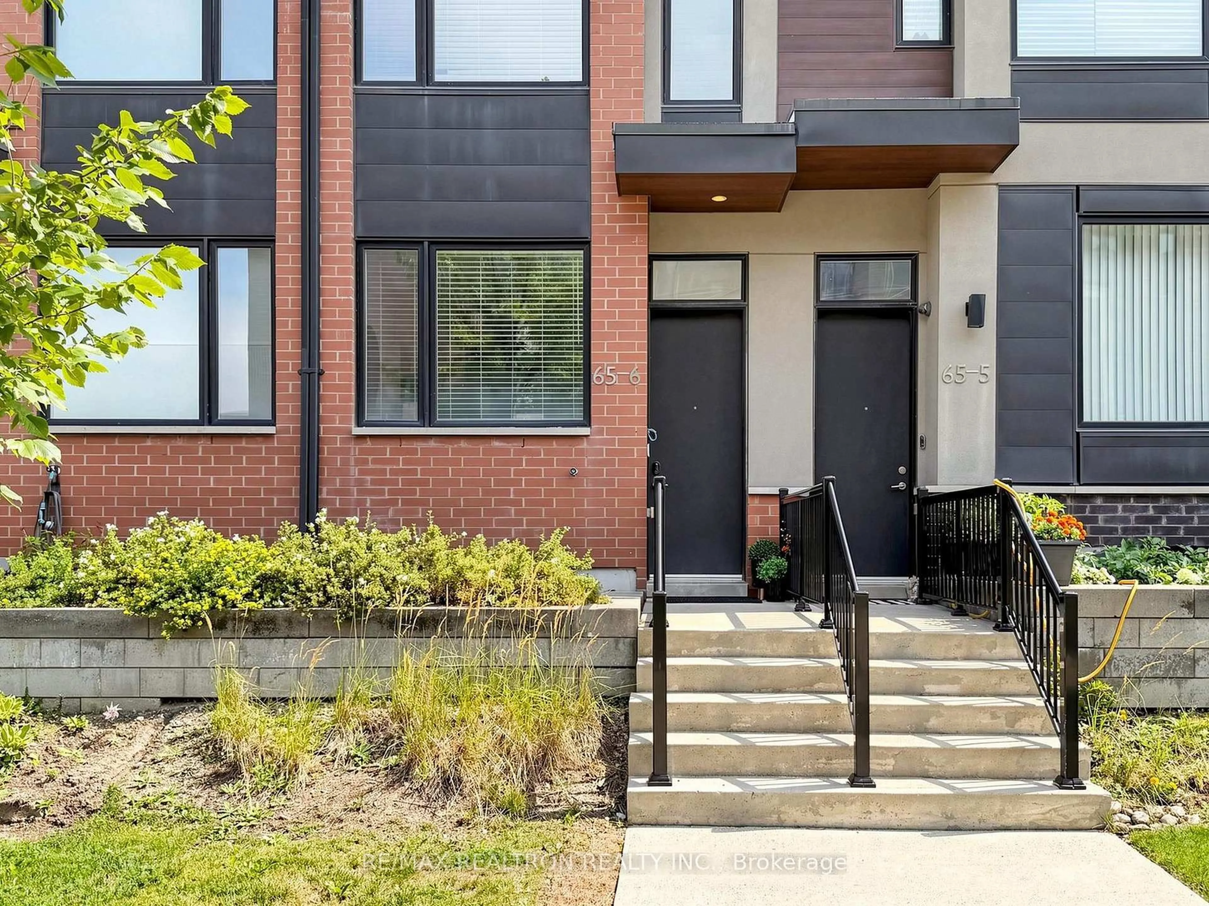 Home with brick exterior material, street for 65 Thomas Mullholand Dr #6, Toronto Ontario M3K 0A7