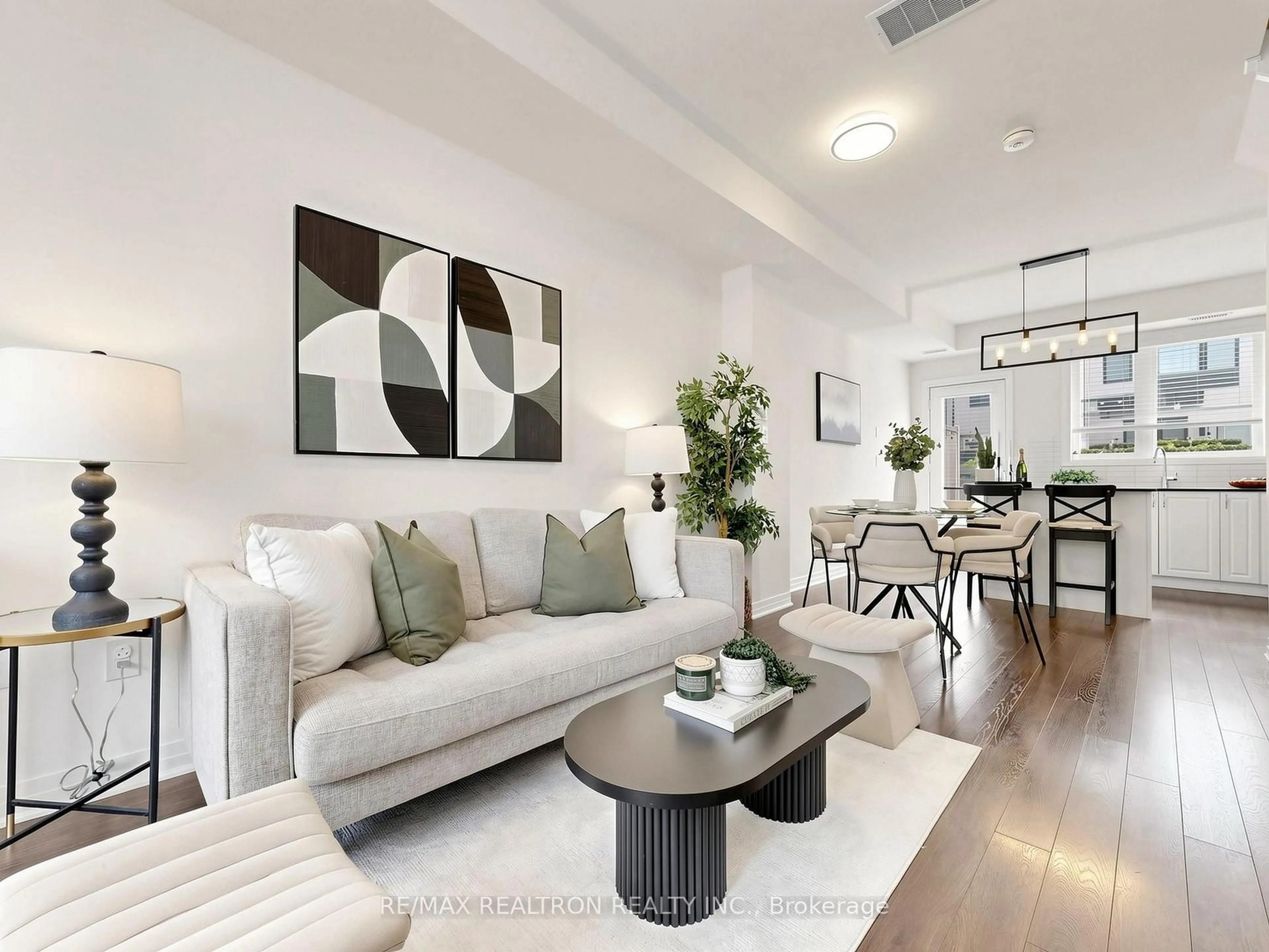 Living room with furniture, unknown for 65 Thomas Mullholand Dr #6, Toronto Ontario M3K 0A7