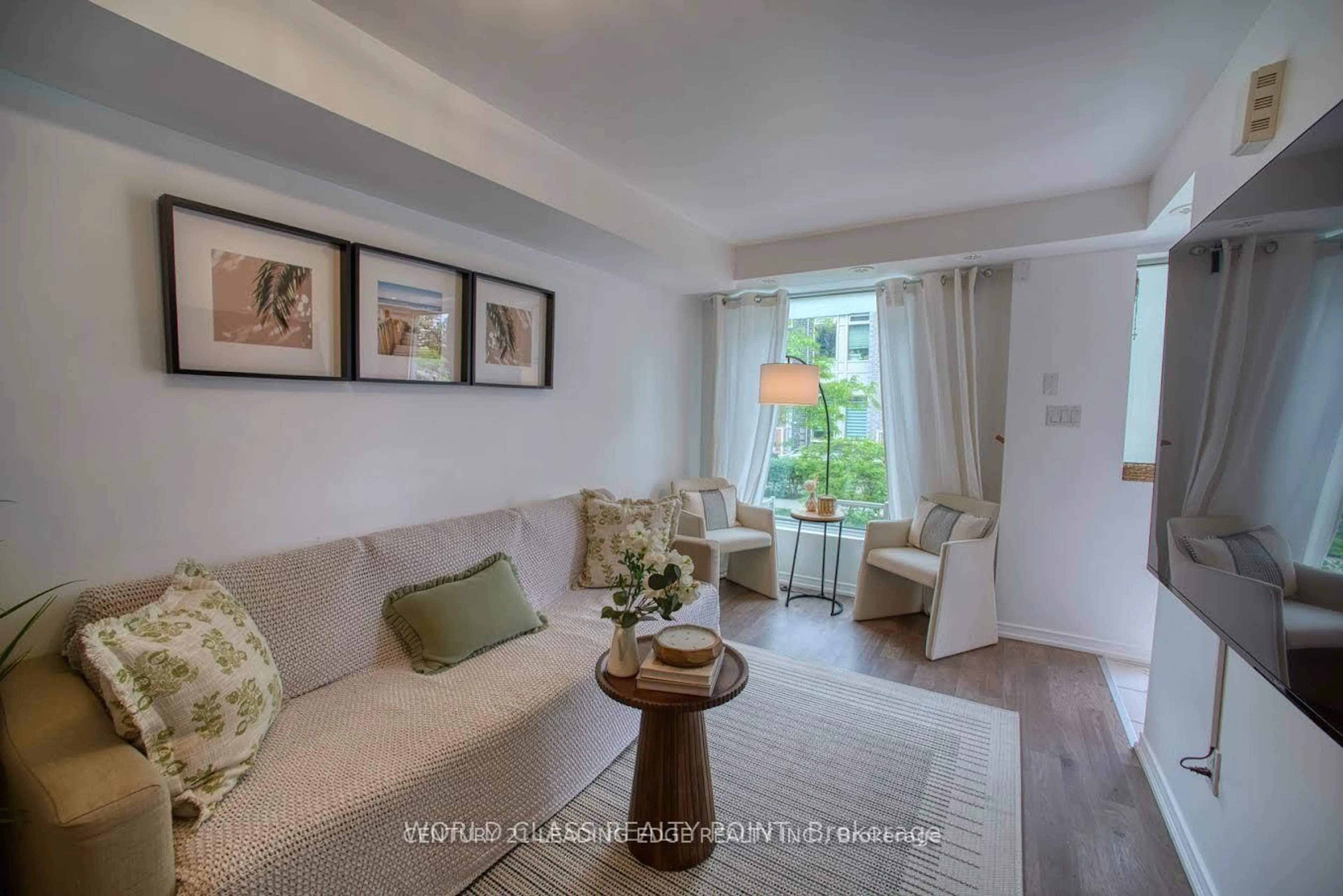 Living room with furniture, unknown for 7 Applewood Lane #221, Toronto Ontario M9C 0C1