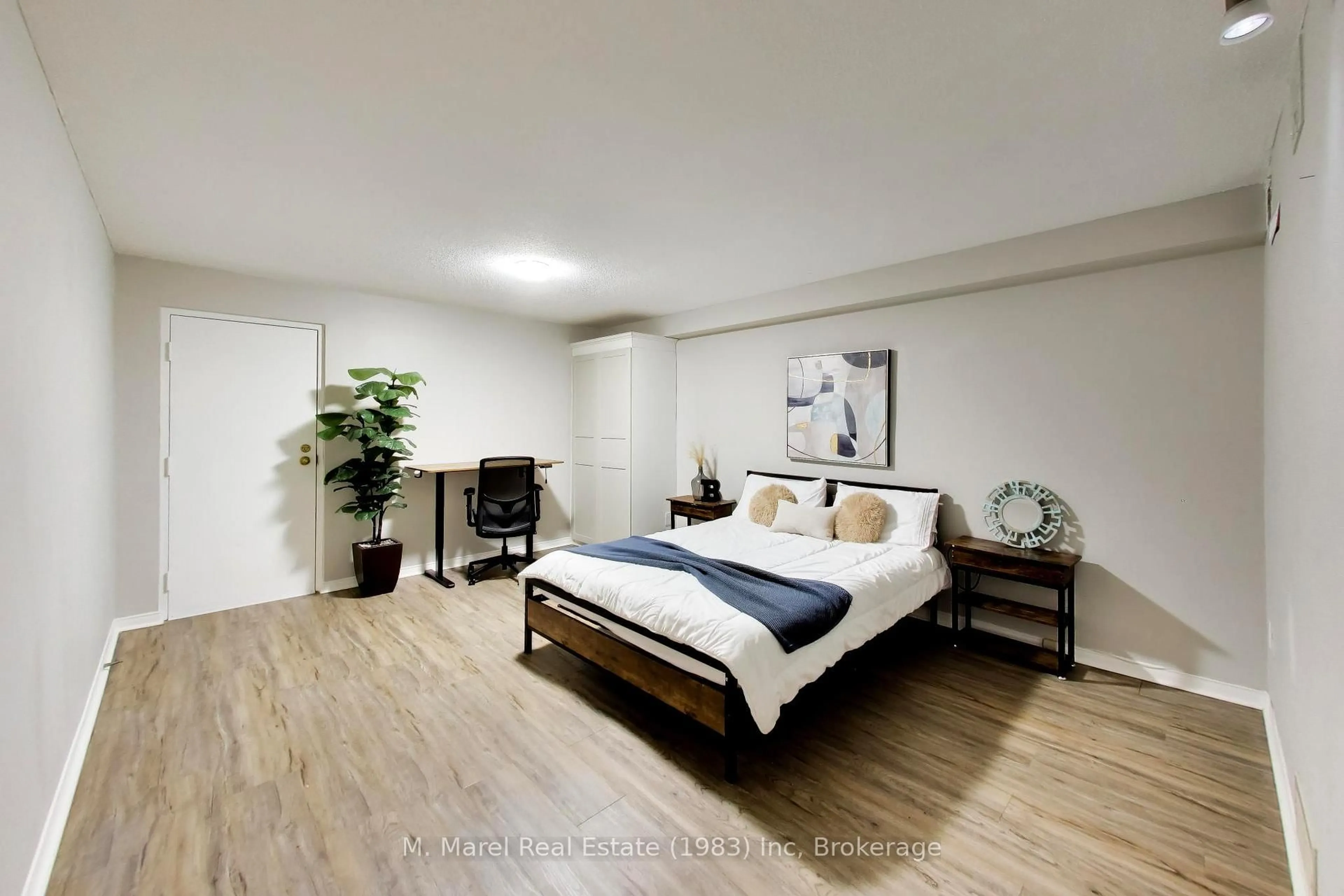 Bedroom with bed, wood/laminate floor for 895 Maple Ave #617, Burlington Ontario L7S 2H7