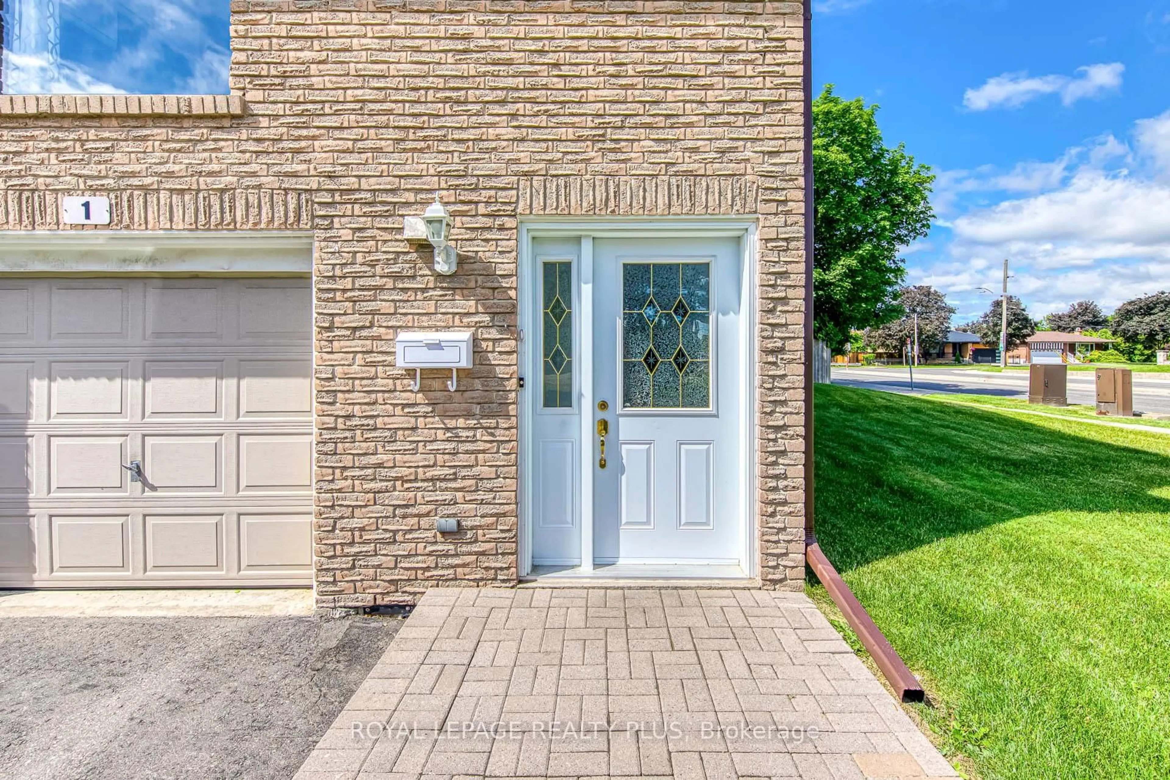 Home with brick exterior material, street for 640 RATHBURN Rd #1, Mississauga Ontario L4Z 1C6