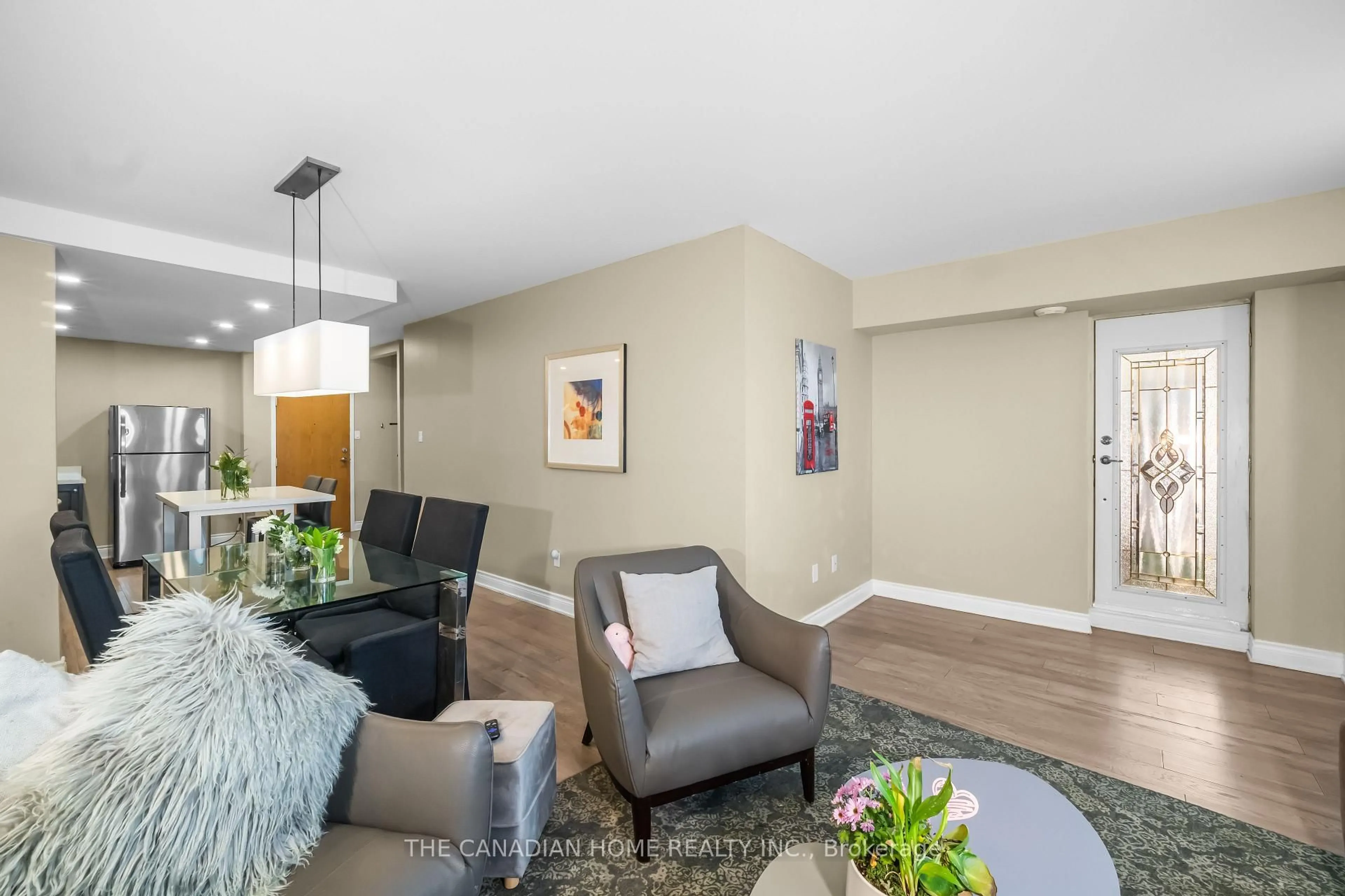 Living room with furniture, unknown for 4 Lisa St #103, Brampton Ontario L6T 4B6