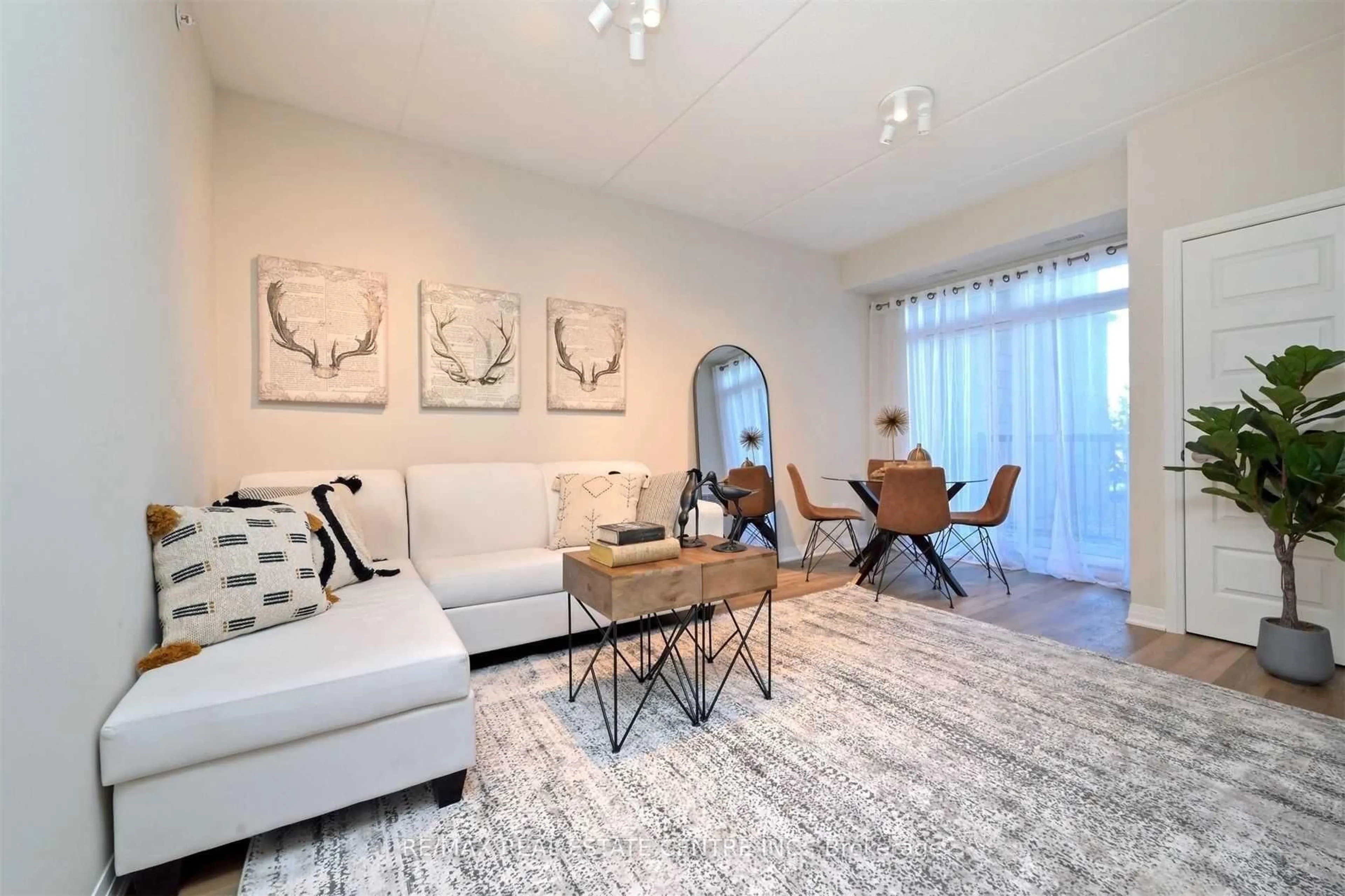 Living room with furniture, unknown for 610 Farmstead Dr #102, Milton Ontario L9T 8X5