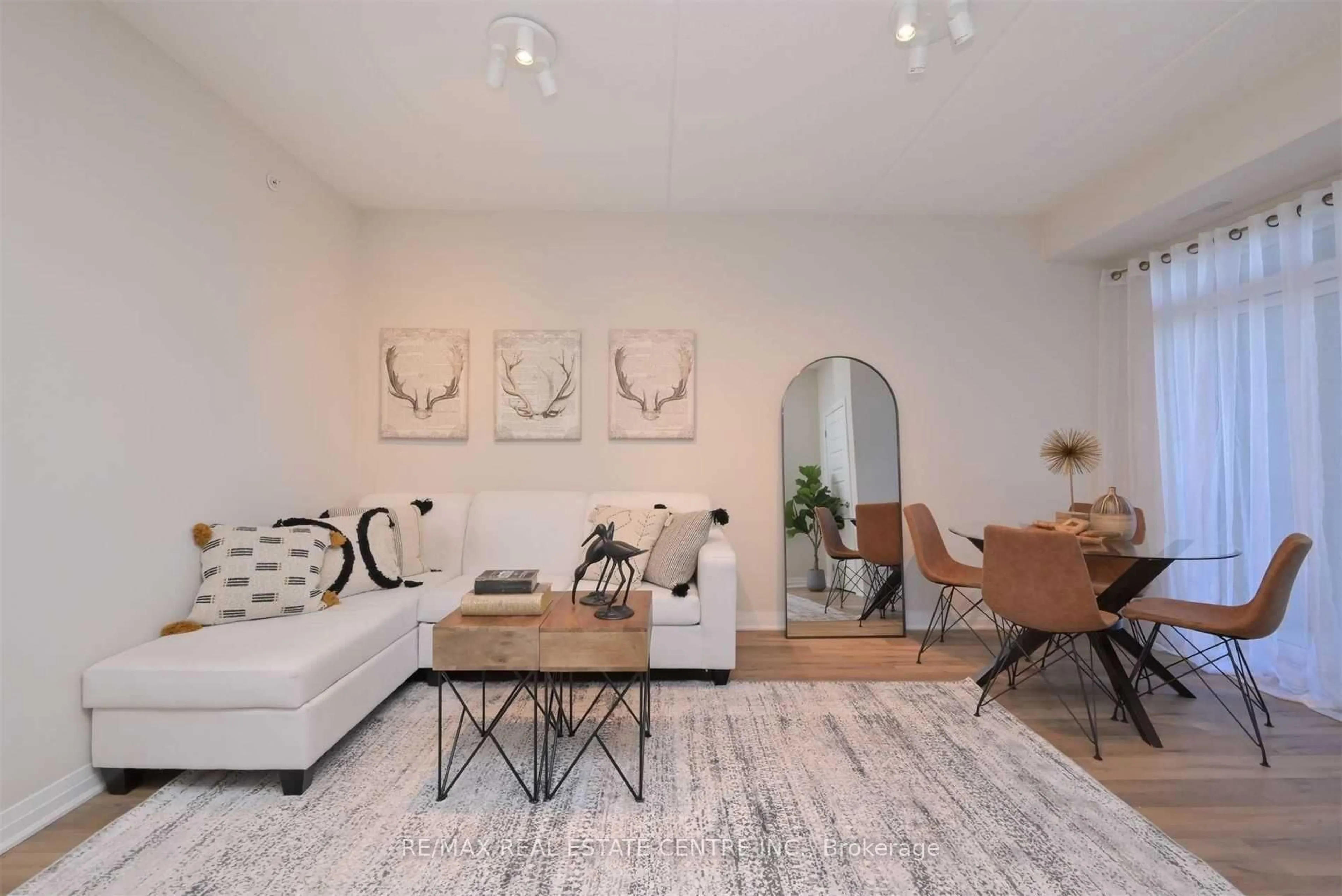 Living room with furniture, unknown for 610 Farmstead Dr #102, Milton Ontario L9T 8X5