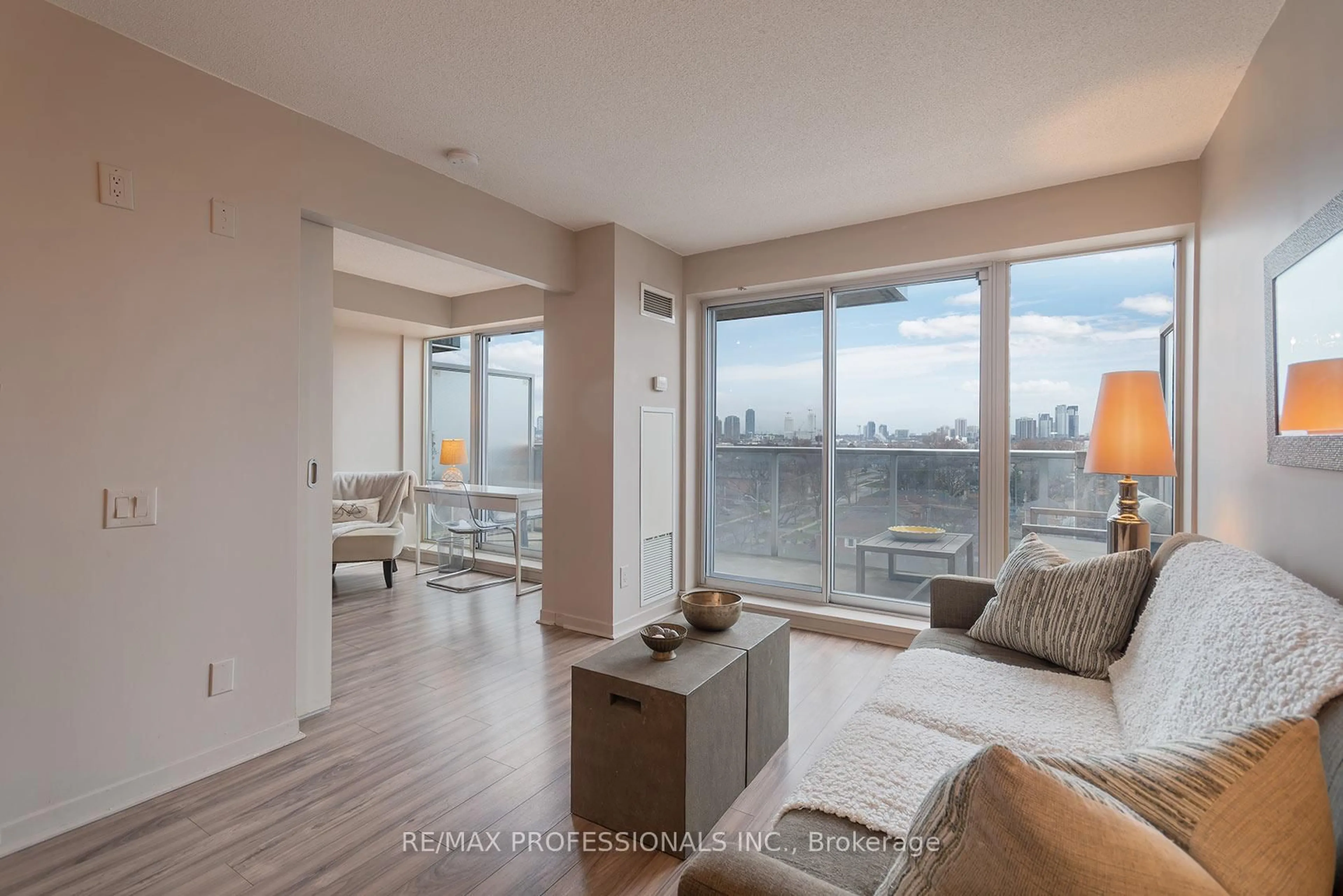 Living room with furniture, wood/laminate floor for 1040 The Queensway #704, Toronto Ontario M8Z 0A7