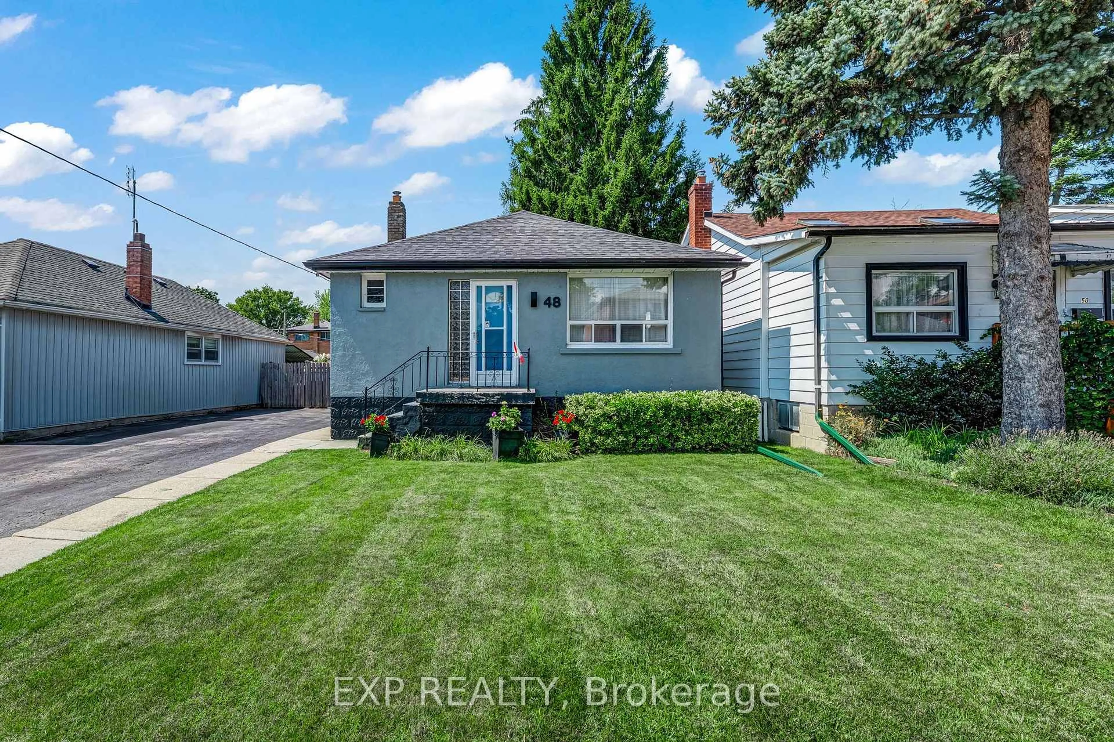Home with vinyl exterior material, street for 48 Sixteenth St, Toronto Ontario M8V 3J8