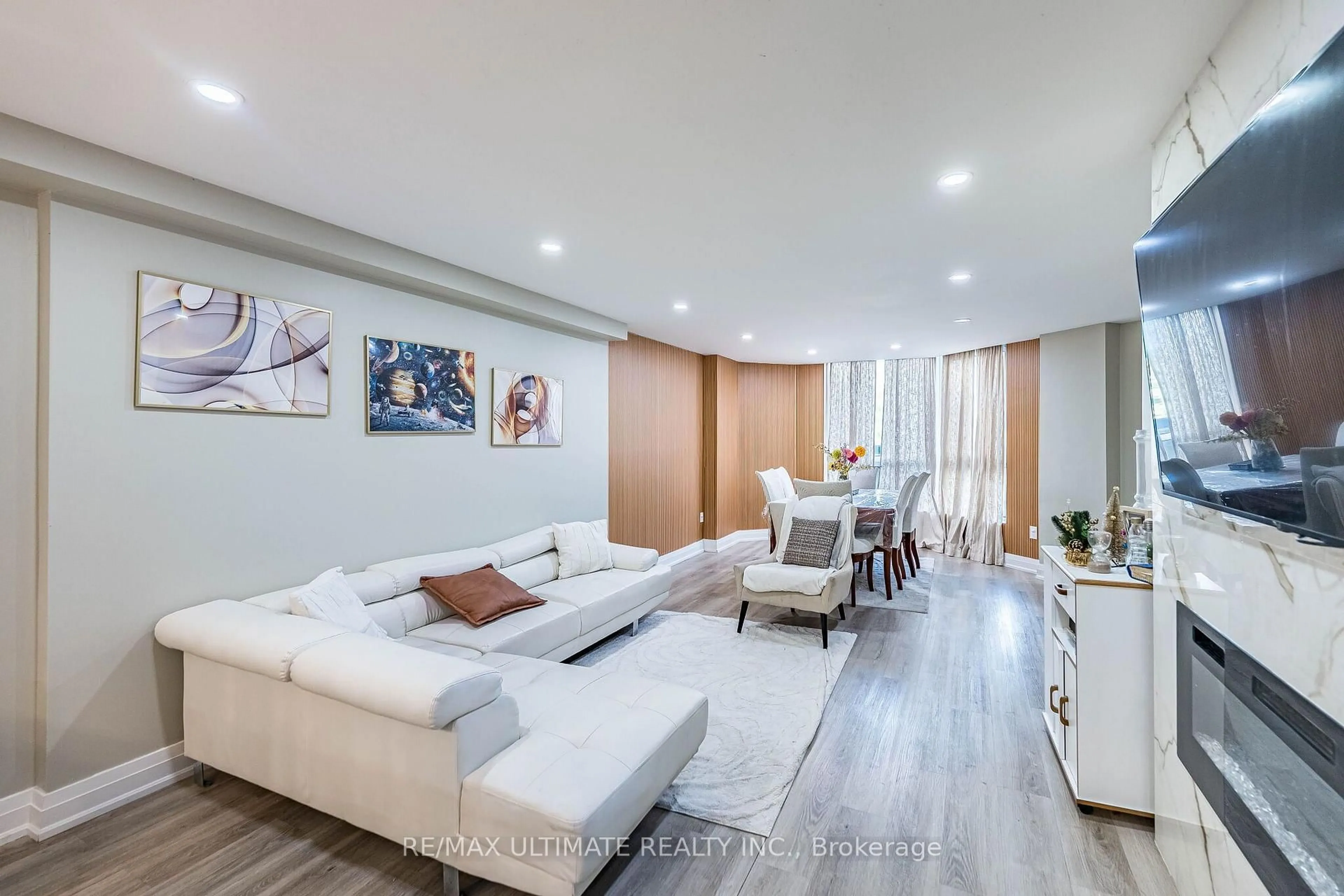 Living room with furniture, wood/laminate floor for 238 Albion Rd #208, Toronto Ontario M9W 6A7