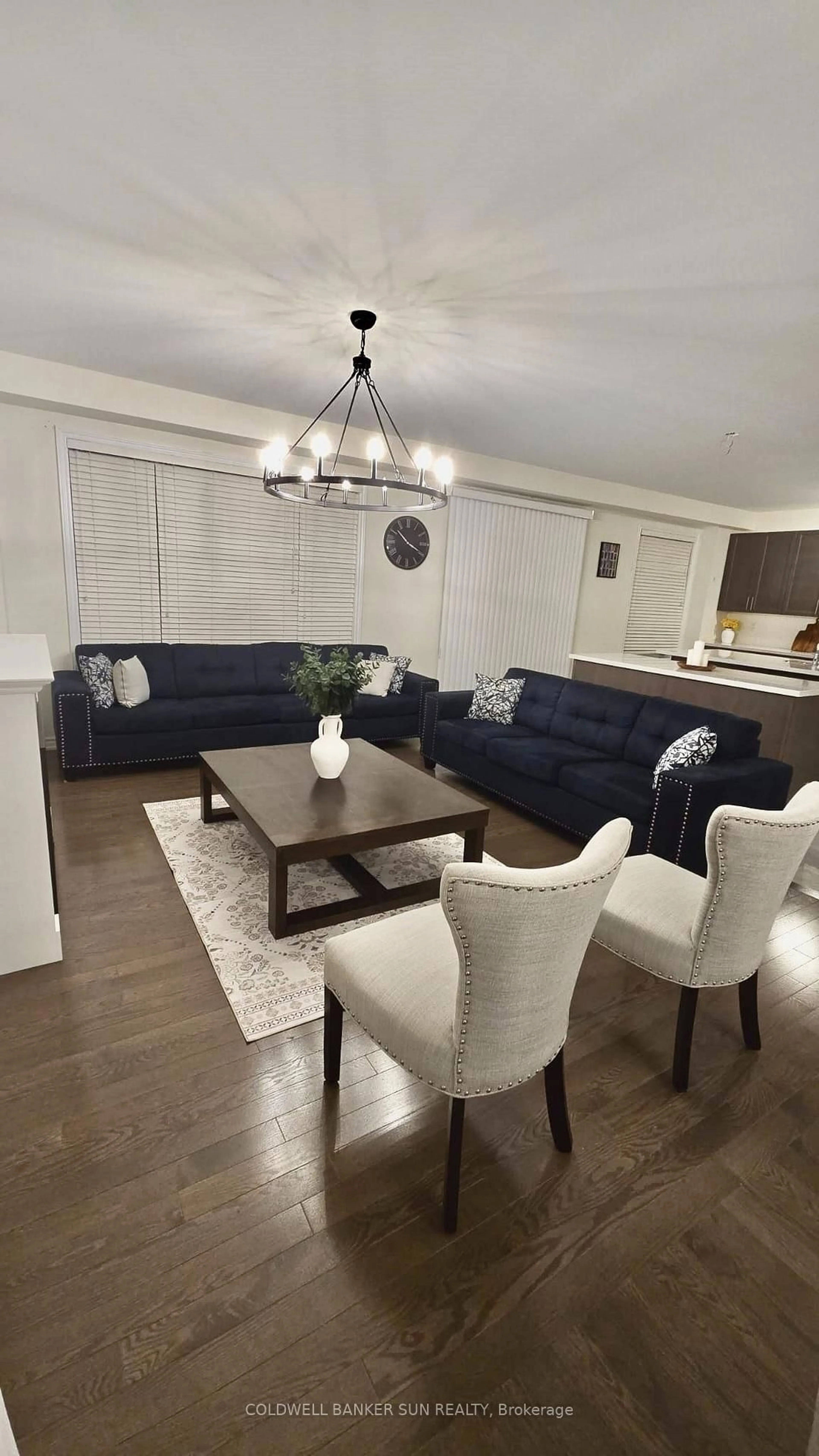 Living room with furniture, wood/laminate floor for 36 Bavenden Cres, Brampton Ontario L6X 5S3