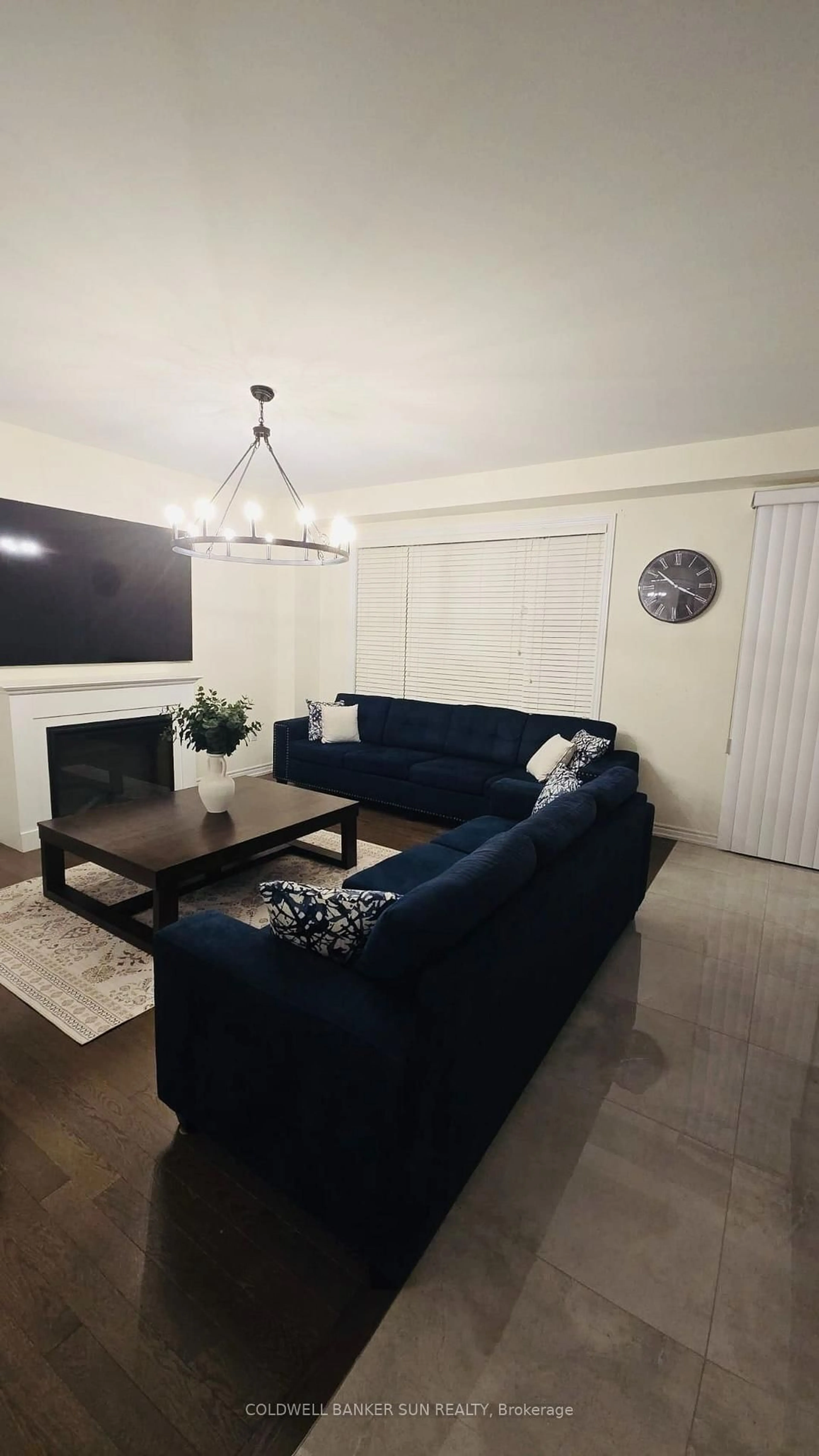 Living room with furniture, wood/laminate floor for 36 Bavenden Cres, Brampton Ontario L6X 5S3