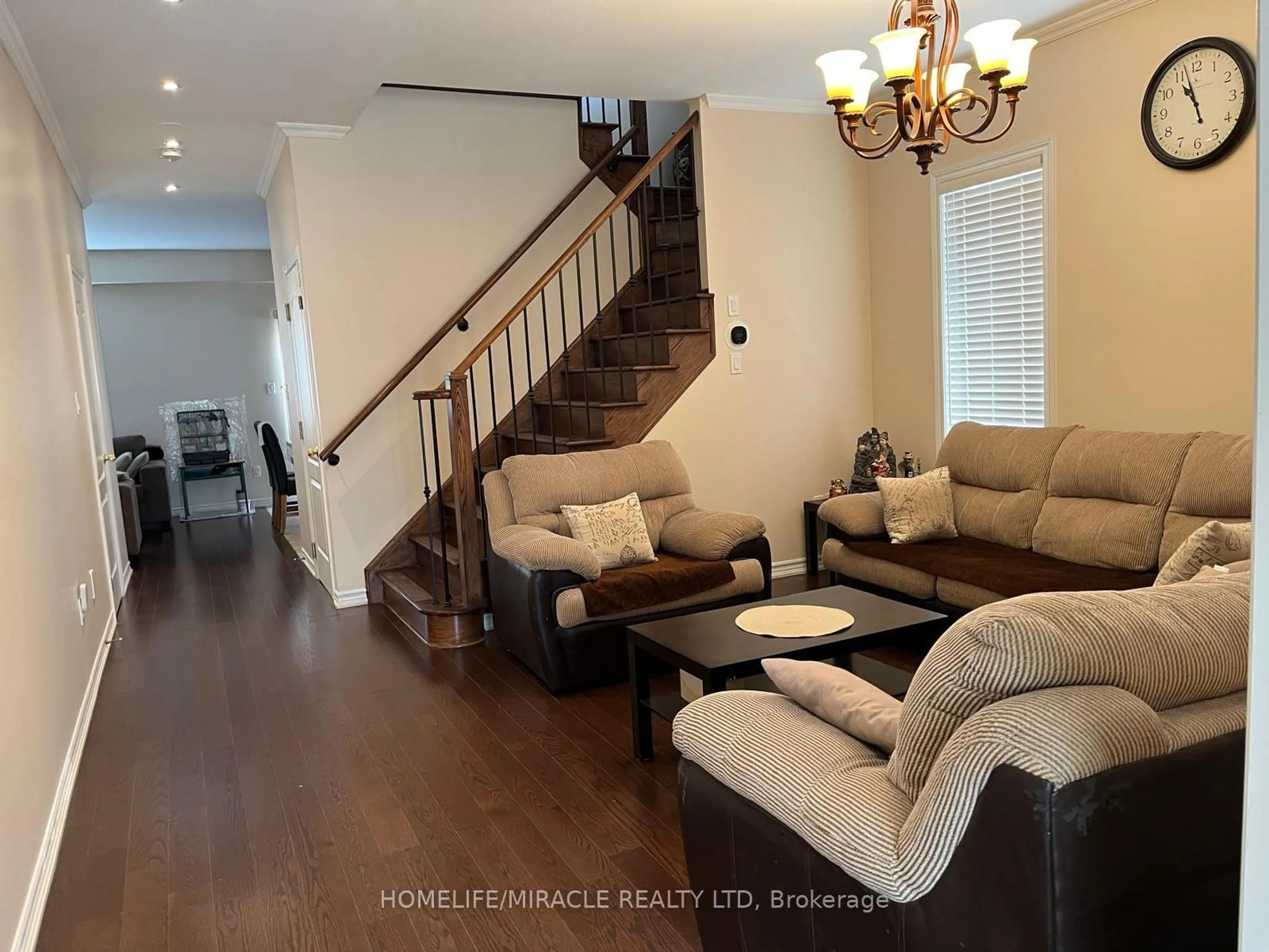 Living room with furniture, wood/laminate floor for 8 Sculptor St, Brampton Ontario L6P 3H5