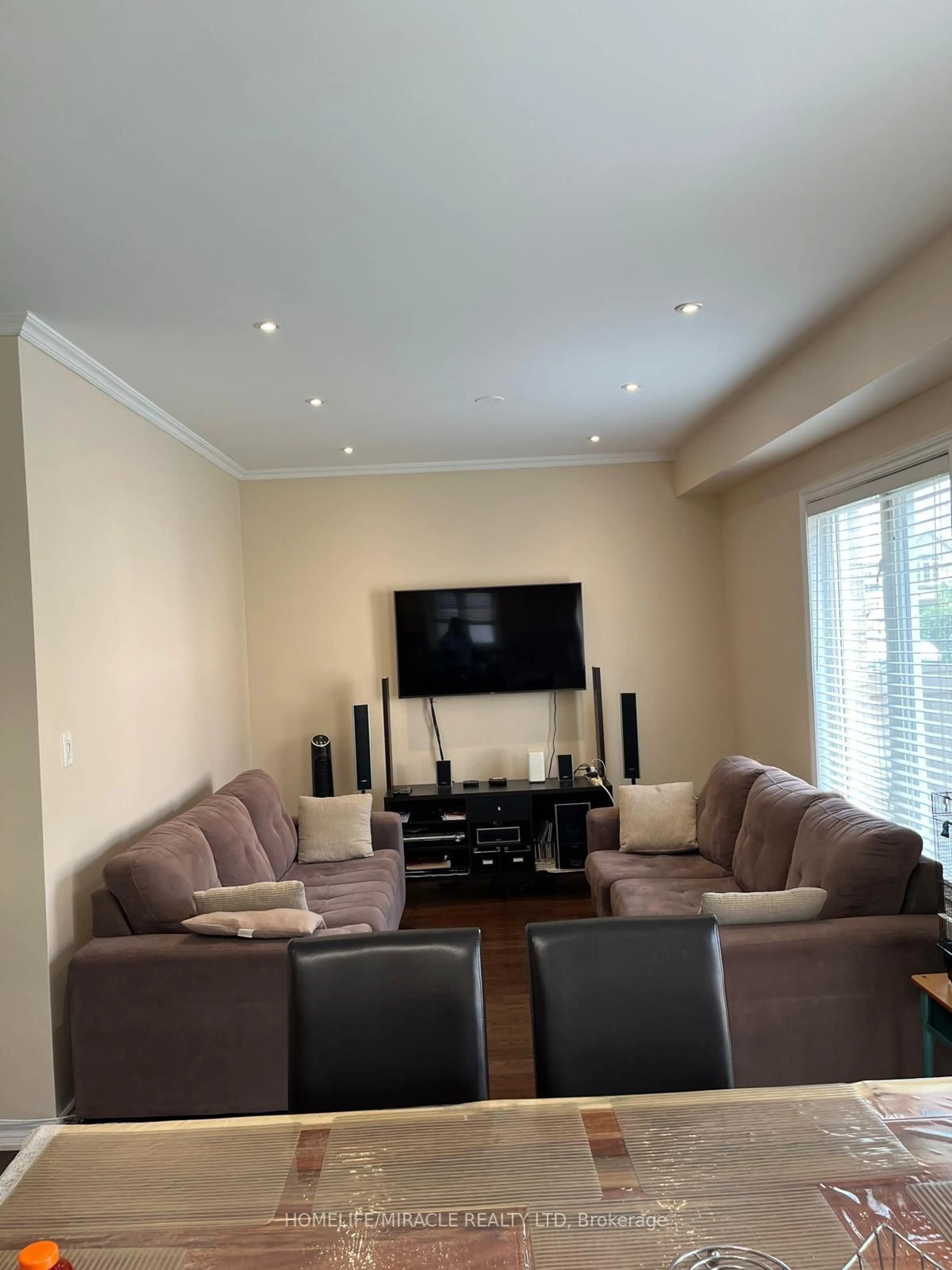 Living room with furniture, wood/laminate floor for 8 Sculptor St, Brampton Ontario L6P 3H5