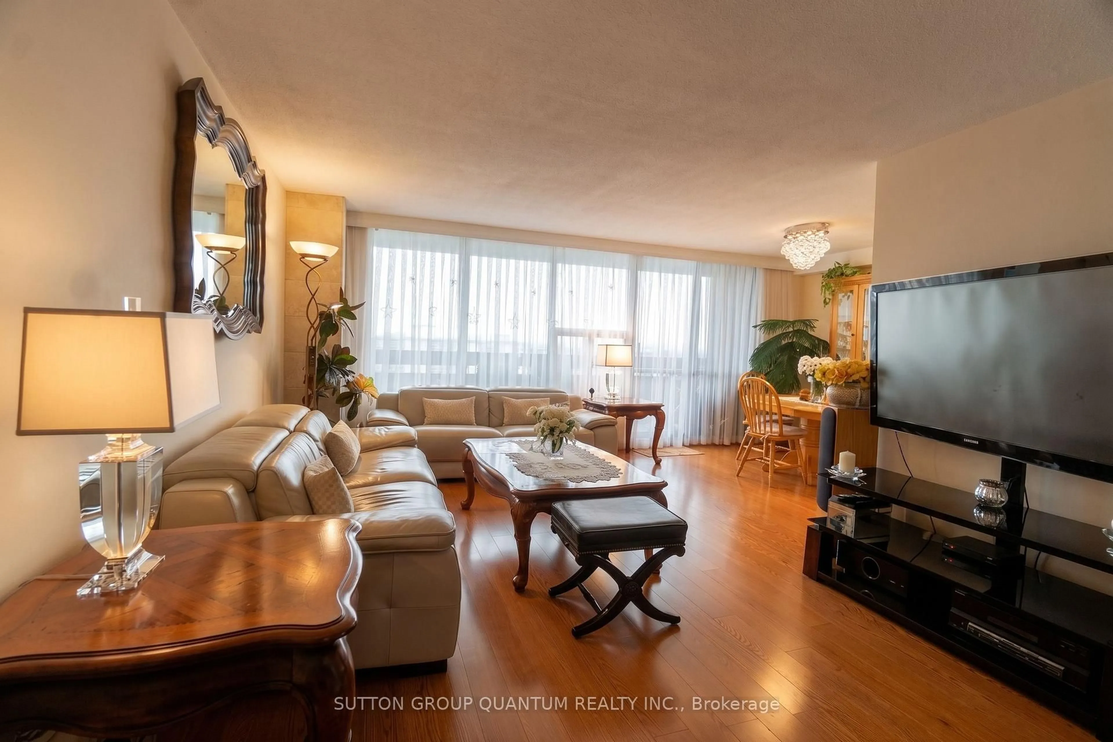 Living room with furniture, wood/laminate floor for 11 Wincott Dr #1810, Toronto Ontario M9R 2R9