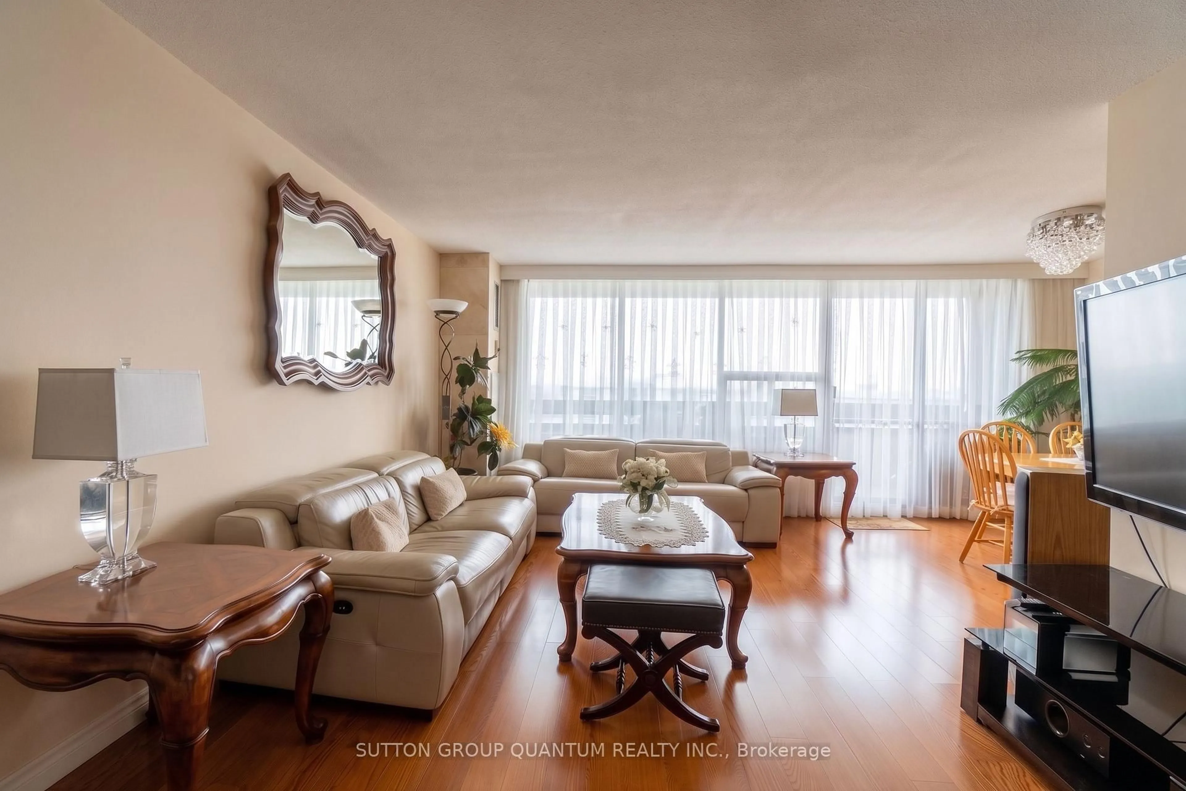 Living room with furniture, wood/laminate floor for 11 Wincott Dr #1810, Toronto Ontario M9R 2R9
