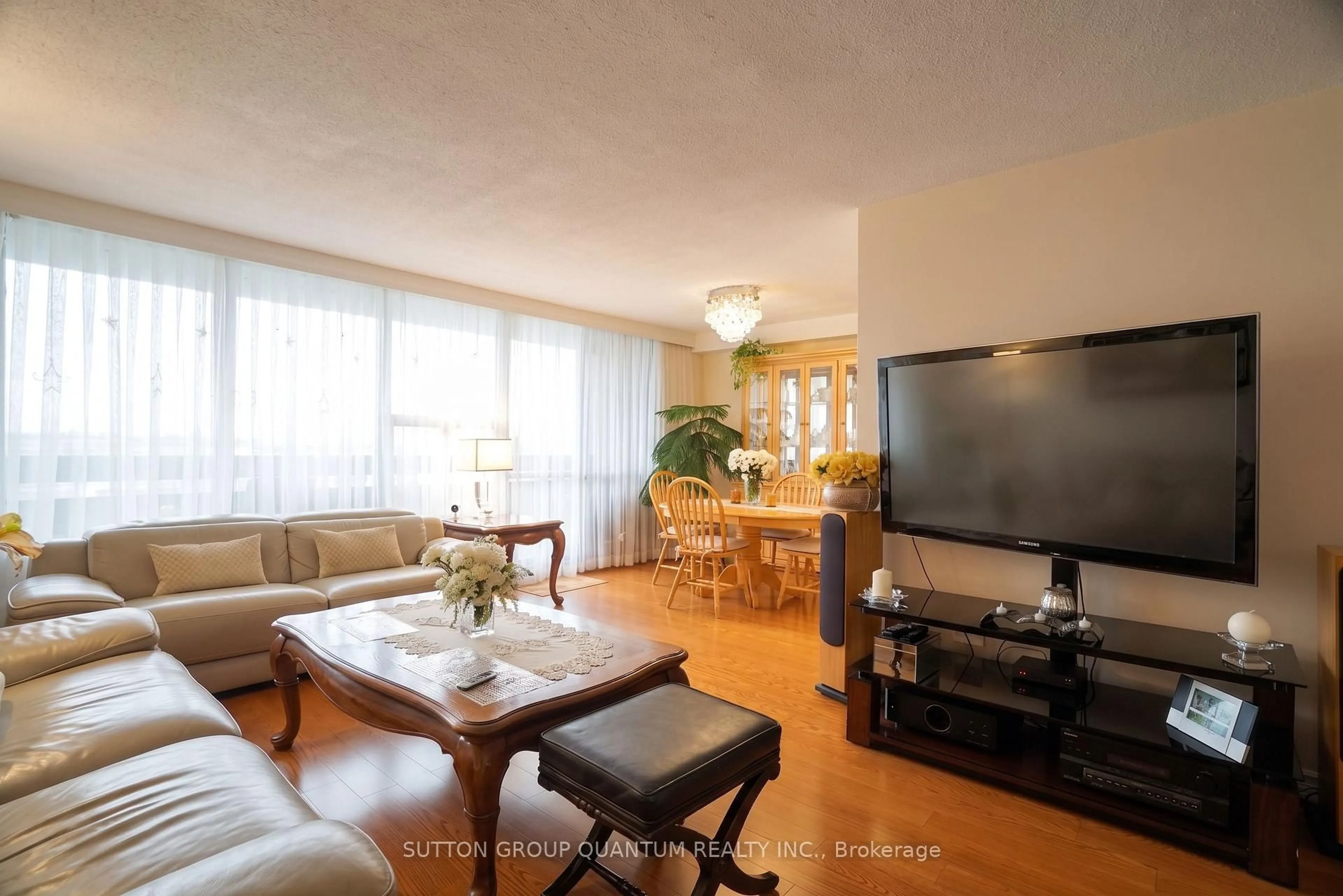 Living room with furniture, wood/laminate floor for 11 Wincott Dr #1810, Toronto Ontario M9R 2R9